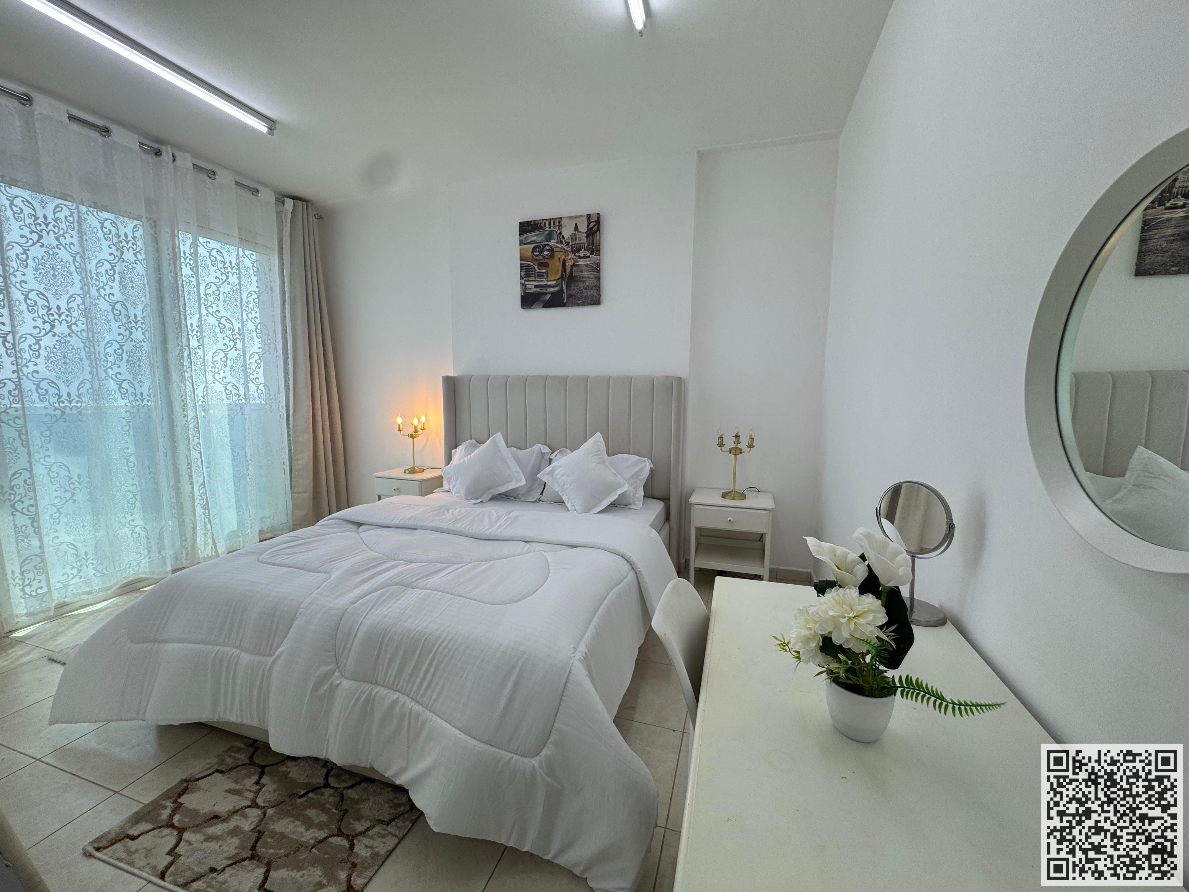 Furnished two-bedroom apartment for monthly rent in Ajman, including utilities, internet, and parking.