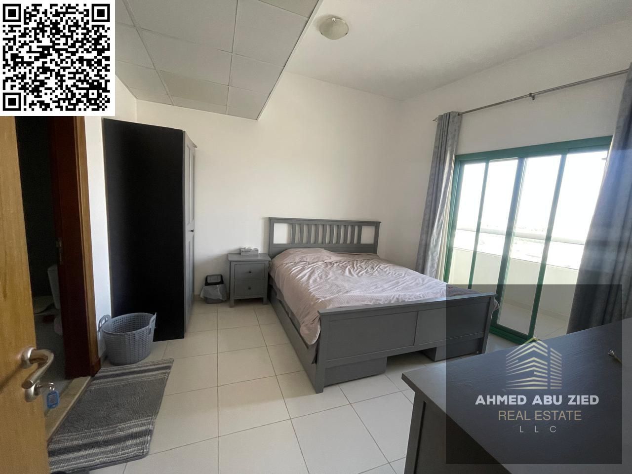 Furnished 1BR apartment for annual rent in Al Amerah Ajman with master bedroom, balcony, 2 bathrooms, and open view – ready to move in