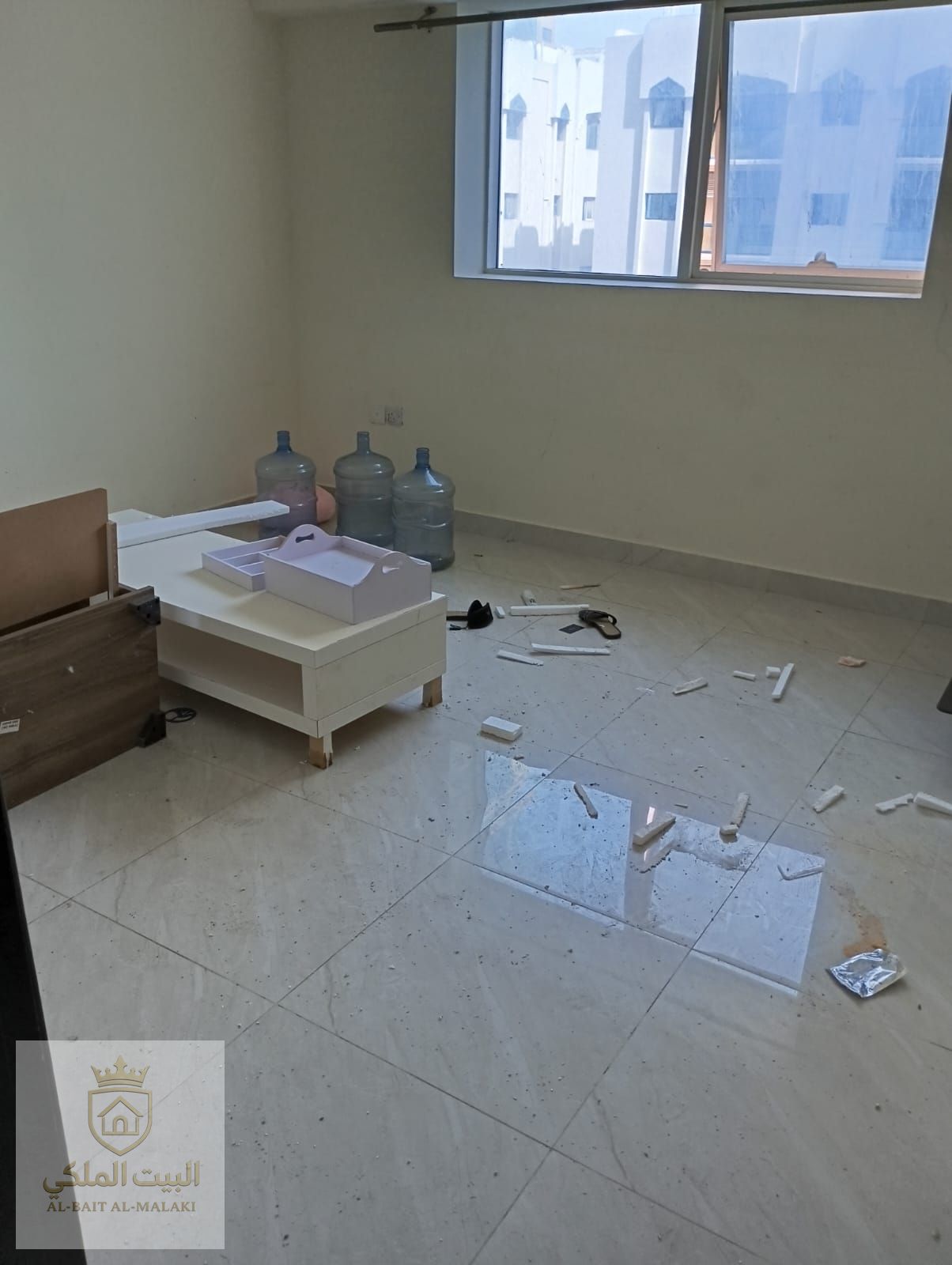 A spacious apartment in Al Majaz 2 featuring three bedrooms and a wide living hall, including a master bedroom and a separate laundry room. The apartment offers built-in wardrobes, a balcony with an open and pleasant view, and free parking. Located in a q
