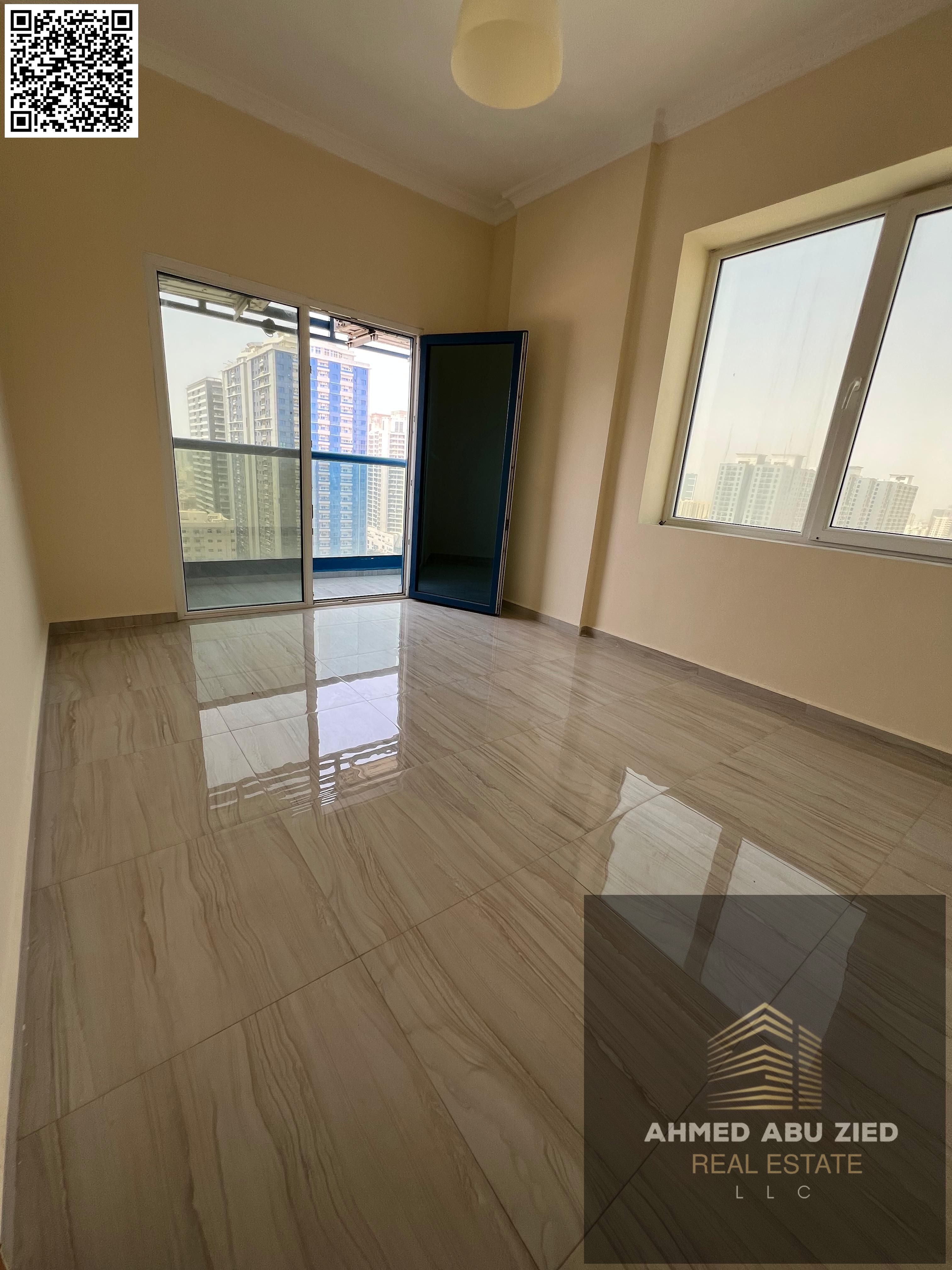 For annual rent, a two-bedroom apartment with a living room in Al Nuaimiya 3, with comfortable spaces and clean finishing, including two bathrooms and