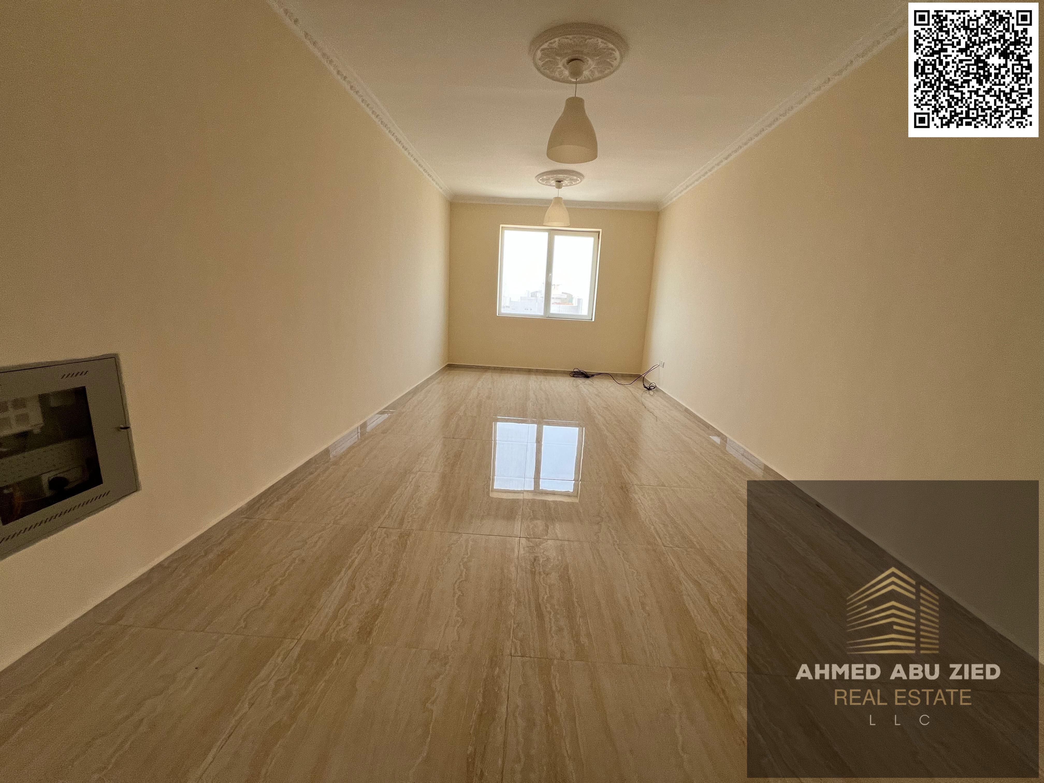Luxury 2BR hall in Al Nuaimiya 3, annual rent, open-view balcony, spacious hall, equipped kitchen, central AC, prime spot, free parking