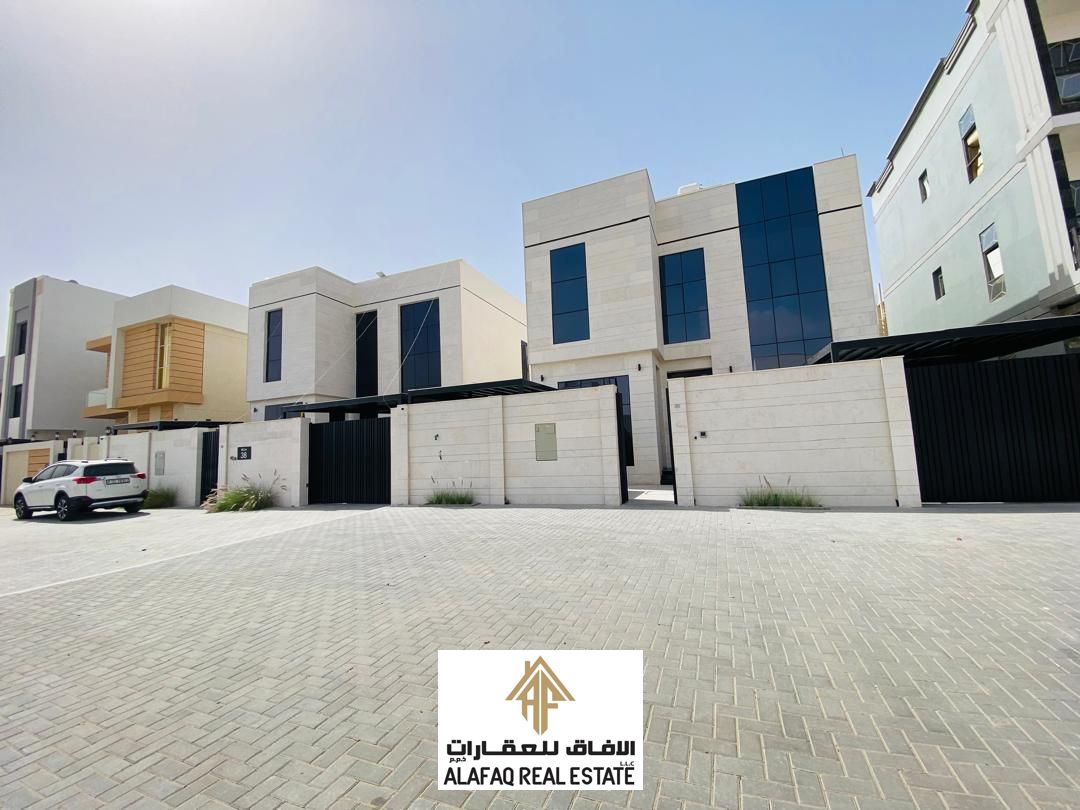 Luxury villa for sale in Al Zahya Area with elegant finishes and a practical design, spacious layout, 4 bedrooms, 2 majlis, 2 kitchens, roof, wide set