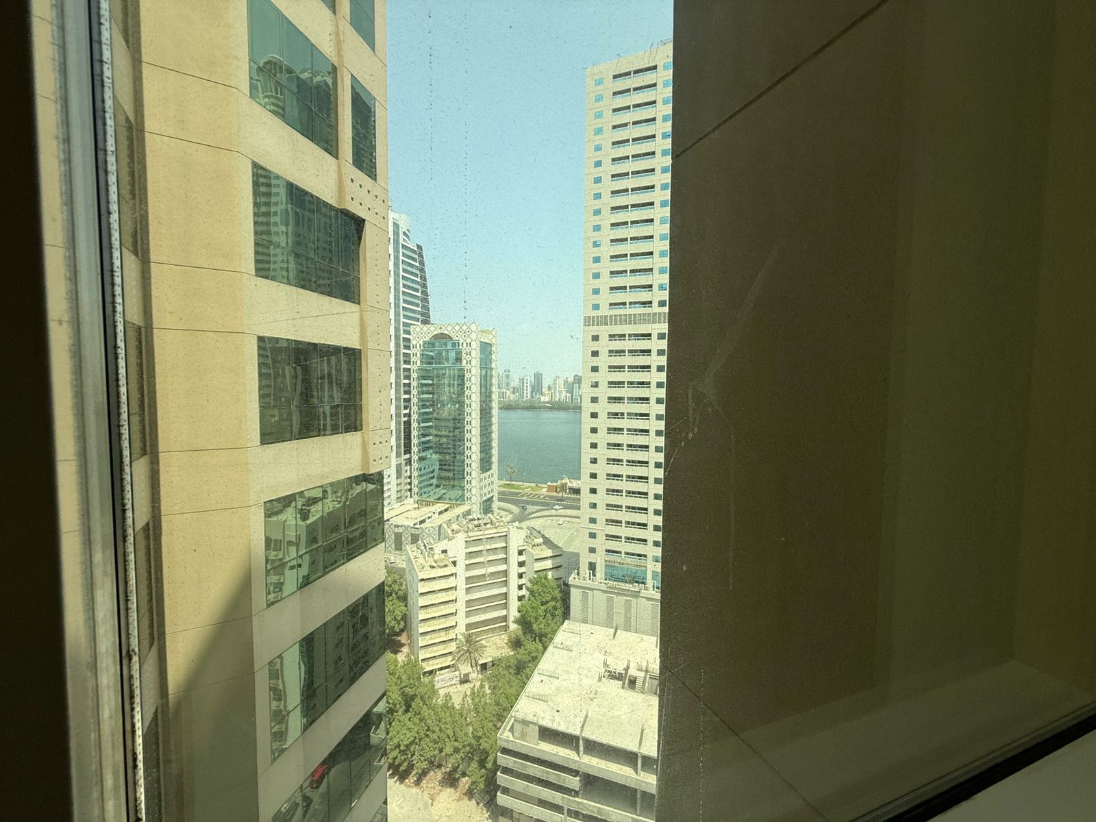 Free AC, free parking and gym, built-in wardrobes, upscale hotel-style entrance, prime vibrant service-oriented location, close to Dubai exit.
