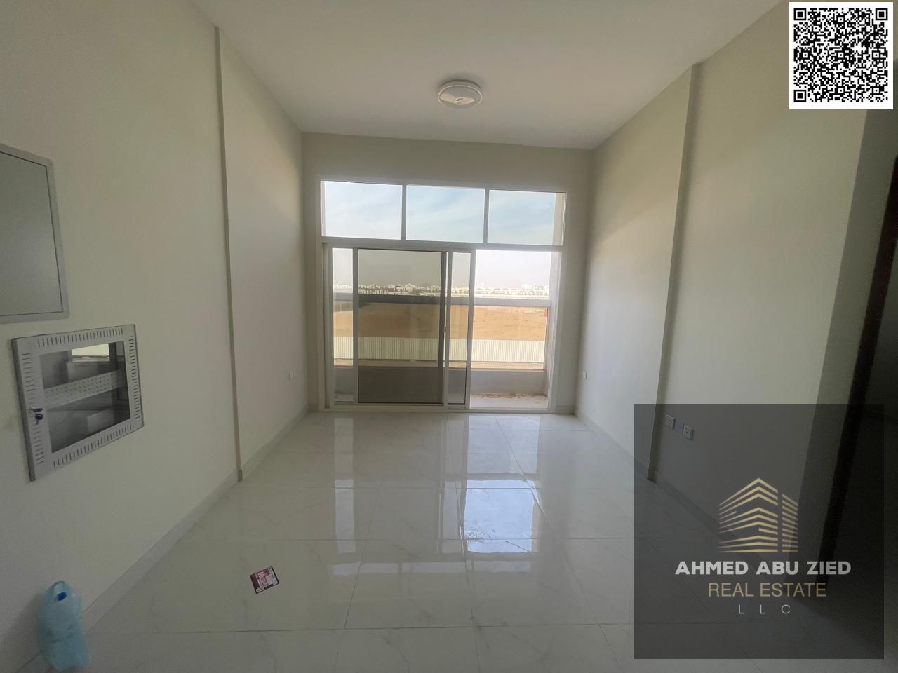 Beautiful 2BR hall apartment in Al Aaliya for annual rent, prime location with easy Dubai/Sharjah access, open balcony, central AC, spacious kitchen