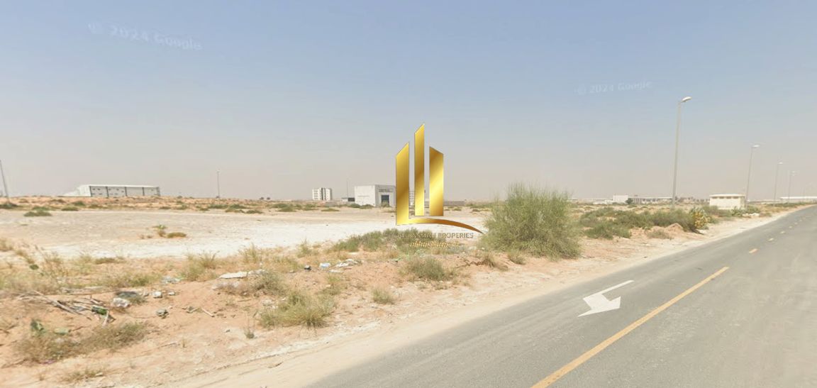 For sale: Industrial land in Al Sajaa Industrial Area - Al Hanoo Al Jalil Industrial land with foundations and a fence, under construction, with an ar