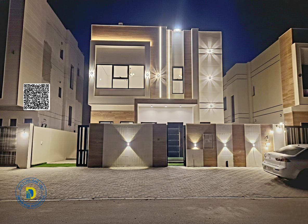 For sale in Al Helio 2, Ajman: a 4-bedroom villa with a terrace, including registration fees, electricity, and water. Bank financing. Freehold.
