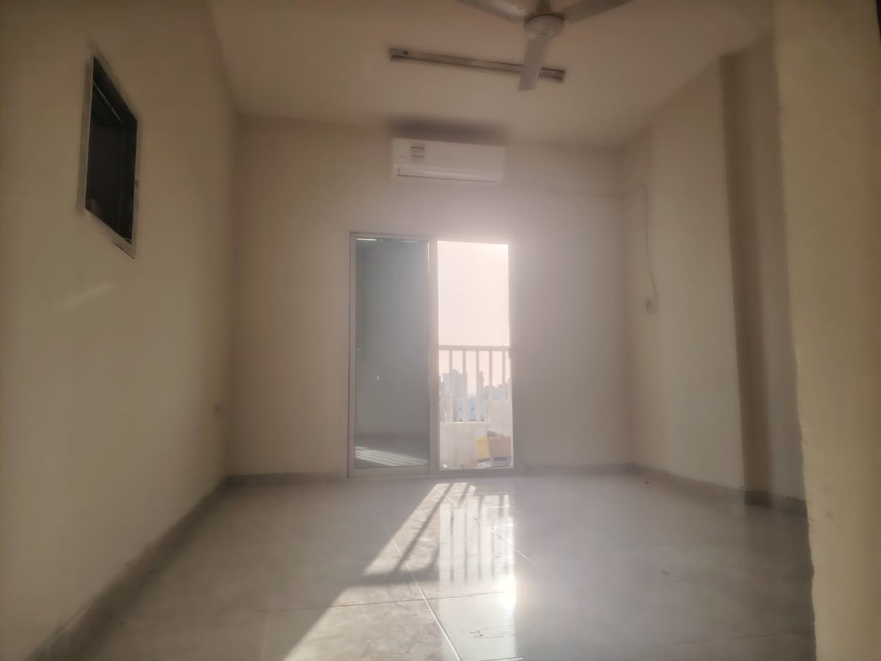 2BR apartment in Al Nuaimiya 1 near Thumbay Hospital, 2 bathrooms, balcony, split AC, prime location, great value.