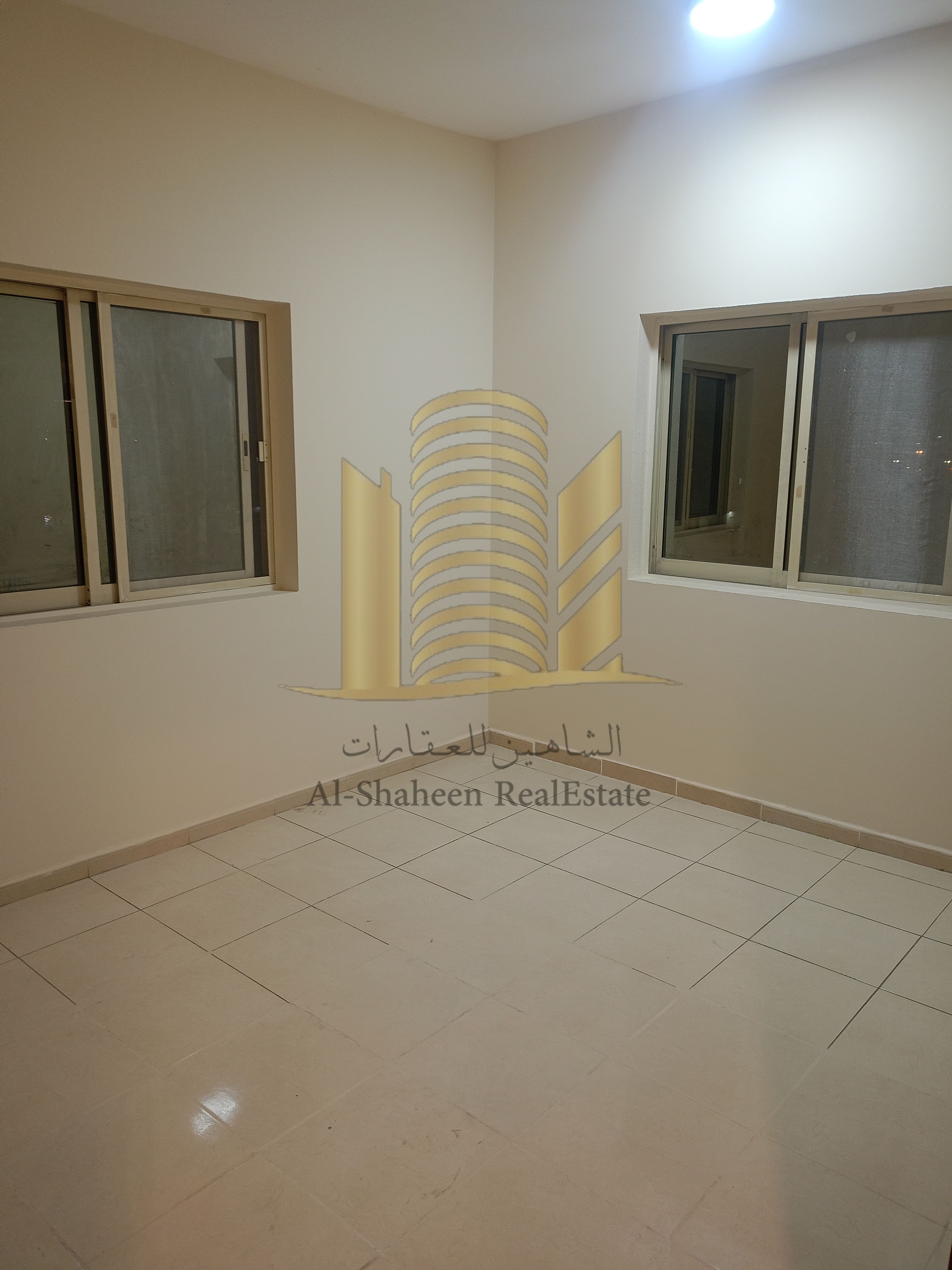 Two-bedroom apartment with a living room for annual rent in Al Rashidiya 2, Ajman, next to Falcon Towers