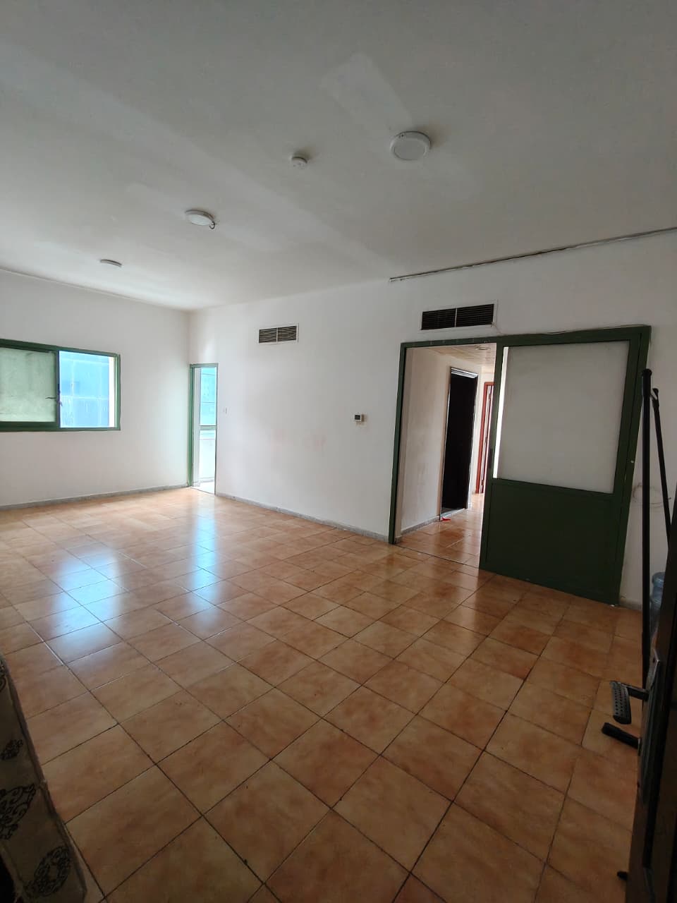 Beautiful two-bedroom family apartment with living room and balcony, central AC, in Al Qasimia Al Mahatta, Sharjah, near Dubai exit and all services.