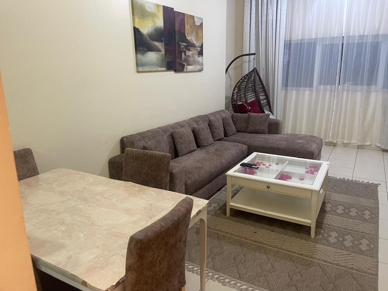 Furnished 1BR in Ajman One Towers, prime location, large layout, all bills included, near Sharjah Corniche.