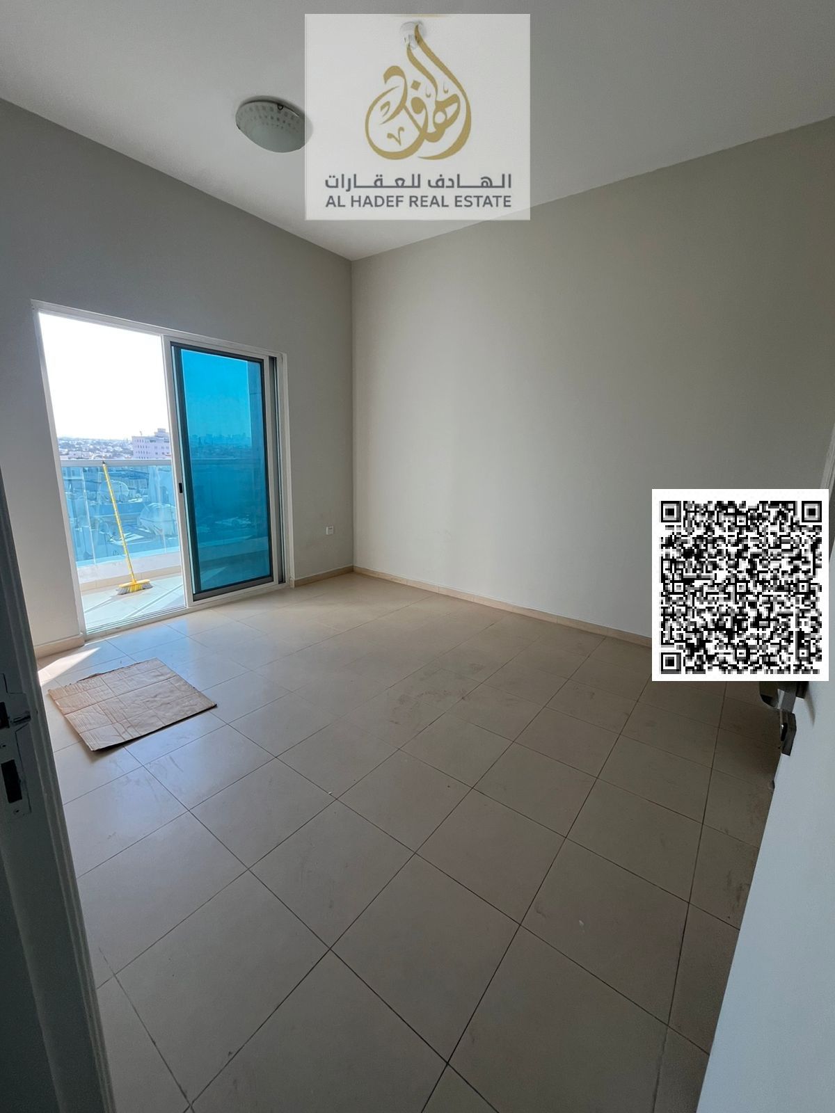 Two bedrooms and a living room in City Tower, Al Nuaimiya 3, behind Al Safeer Mall. Two bathrooms and a balcony with a fully open view, plus parking.