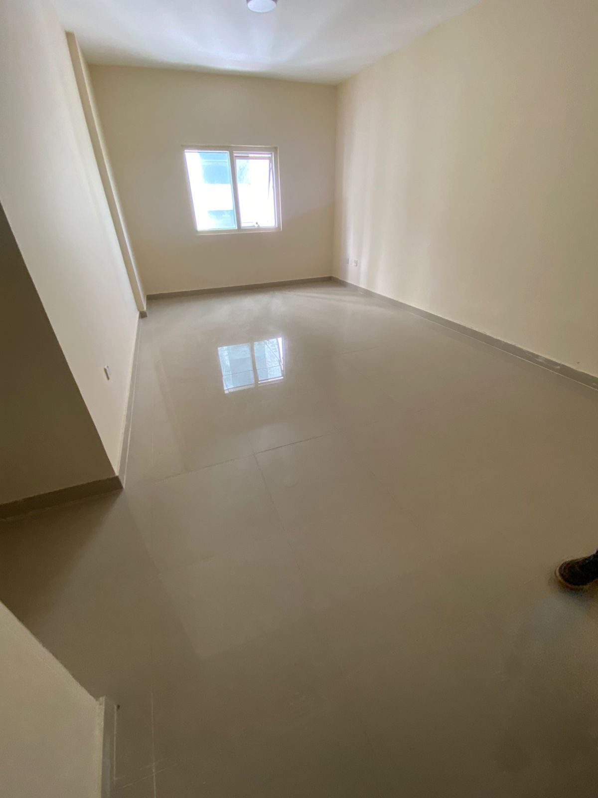 2BR apartment in Al Majaz, central AC & parking, near Corniche & services, prime location, family-friendly.