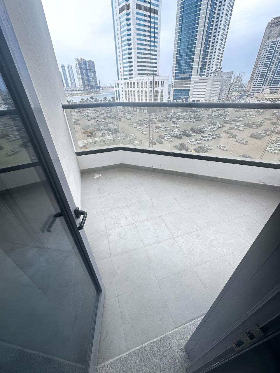Two rooms and a hall with a storage room in Al Khan, balcony and free parking. Second occupant: families only. Payment facilities: 70,000 dirhams.