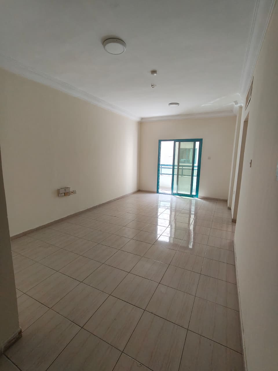 Spacious 2BR apartment in Al Qasimia Al-Nad for families, bright living room, safe area, rent 38,000 AED, 4-6 installments.