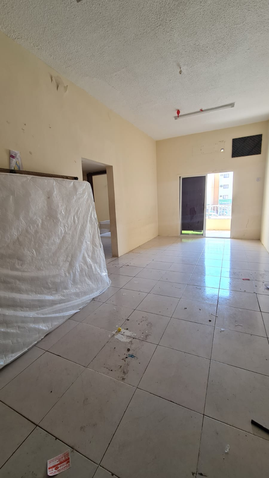 One-bedroom apartment in Al Butina with 2 balconies. Rent 25,000 AED, 4 payments. AC by tenant.