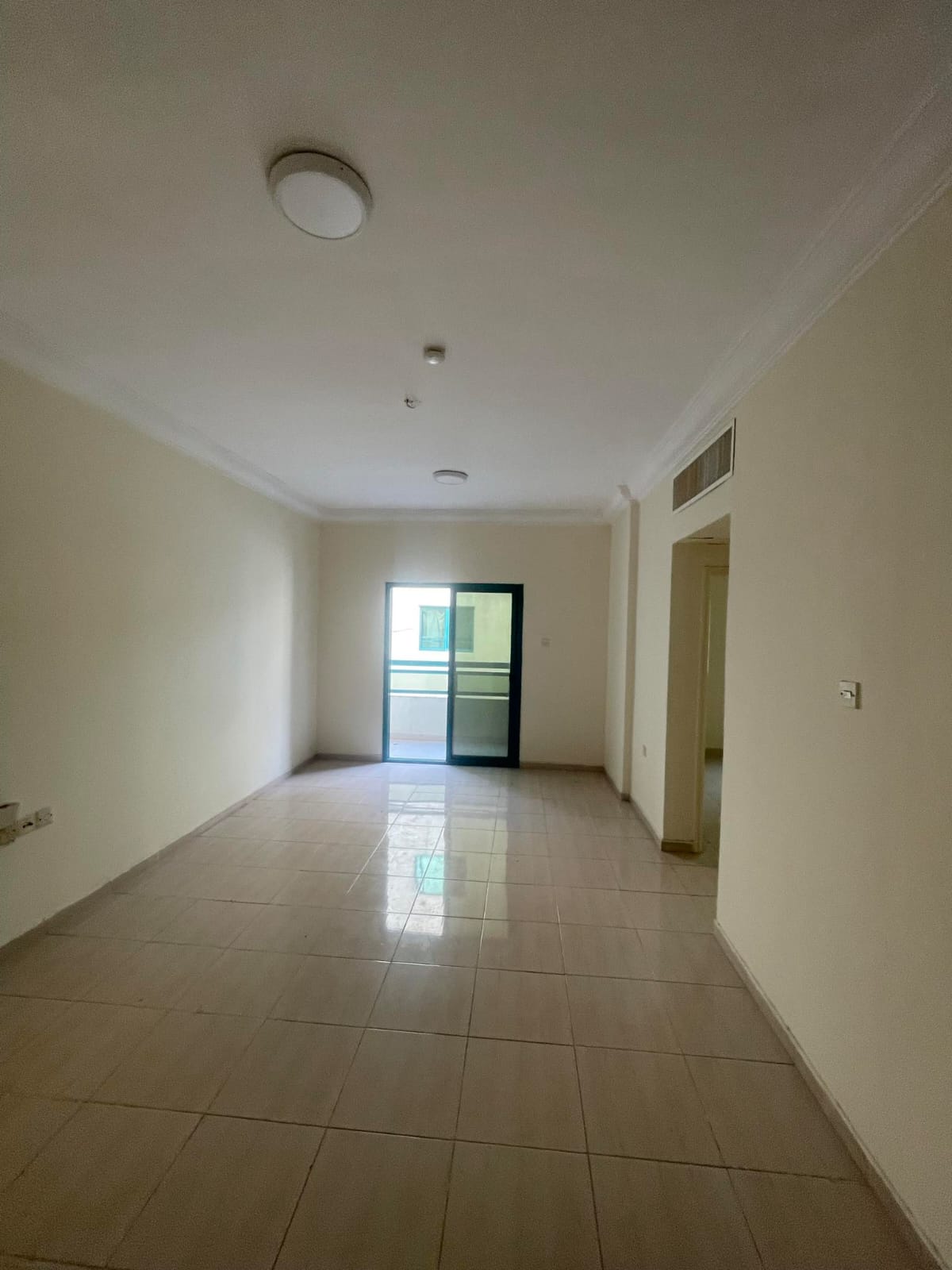 For rent in Al Qasimia Al Nadd: 2BR + hall, 2 baths, balcony, clean upscale building, prime location close to all services.