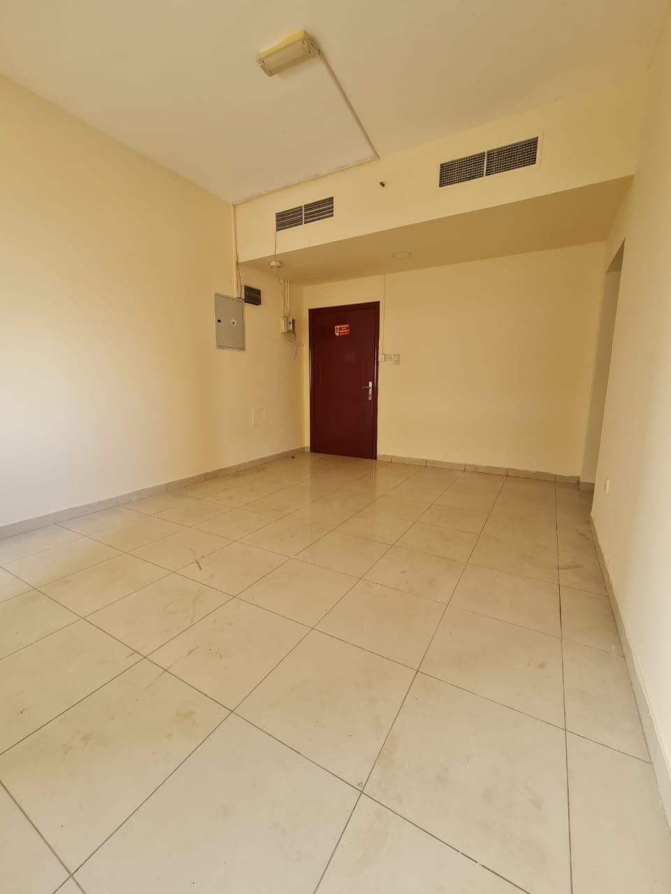 Two-bedroom apartment with living room in Al Naba’a, central AC and gas. Annual rent 33,000 AED in 4 payments. Family building.