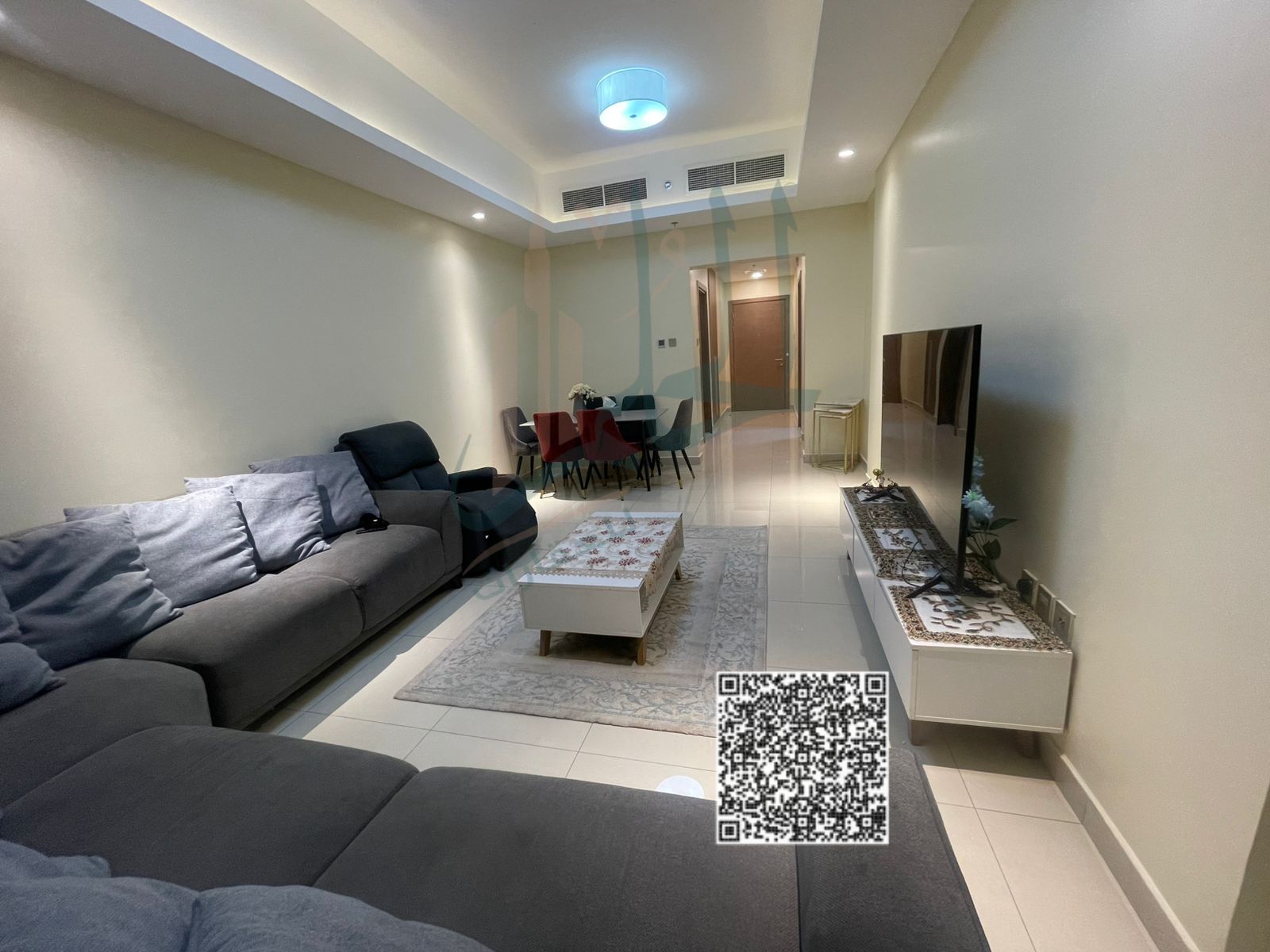 Luxury one-bedroom apartment with gym, swimming pool, and parking, fully furnished with new furniture, available for monthly rent in Ajman - Al Rashid