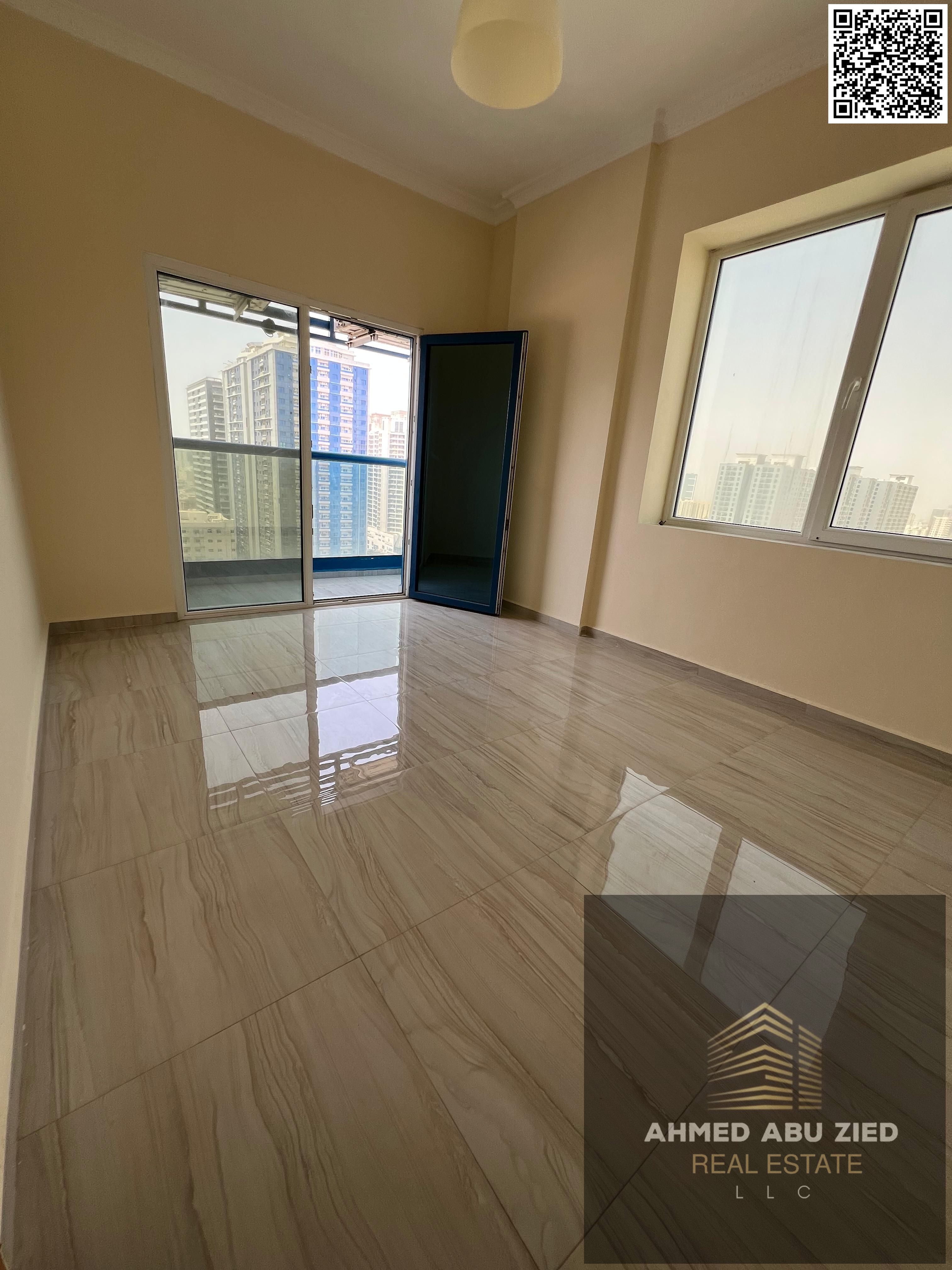 Upscale and luxurious two-bedroom apartment with a large living room, spacious kitchen, two bathrooms, free parking, balcony with open views, central