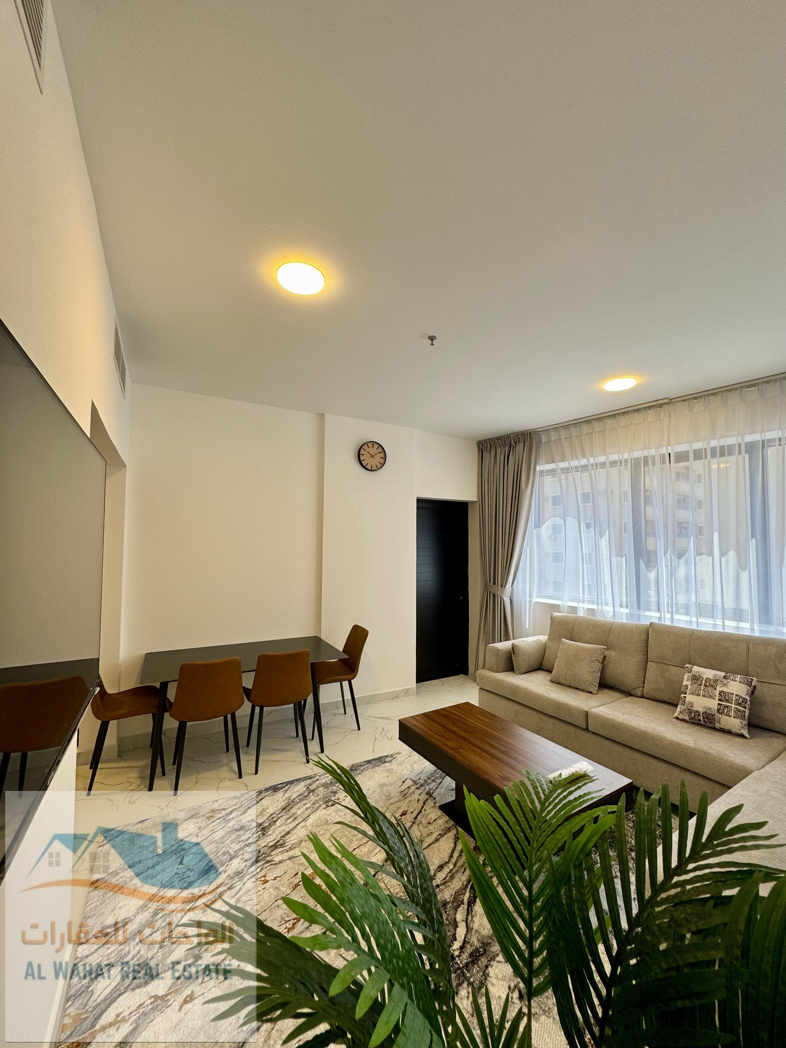 Furnished Apartments for Monthly Rent – VIP Furnishings Ajman Corniche | Al Andalus Building One bedroom and living room furnished with VIP