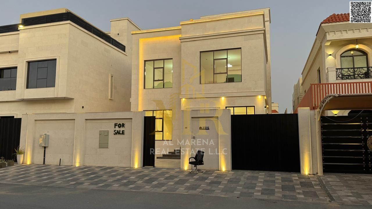 Luxury villa for sale in one of Ajman's best areas, including water, electricity, and air conditioning - featuring a luxurious modern design - freehol
