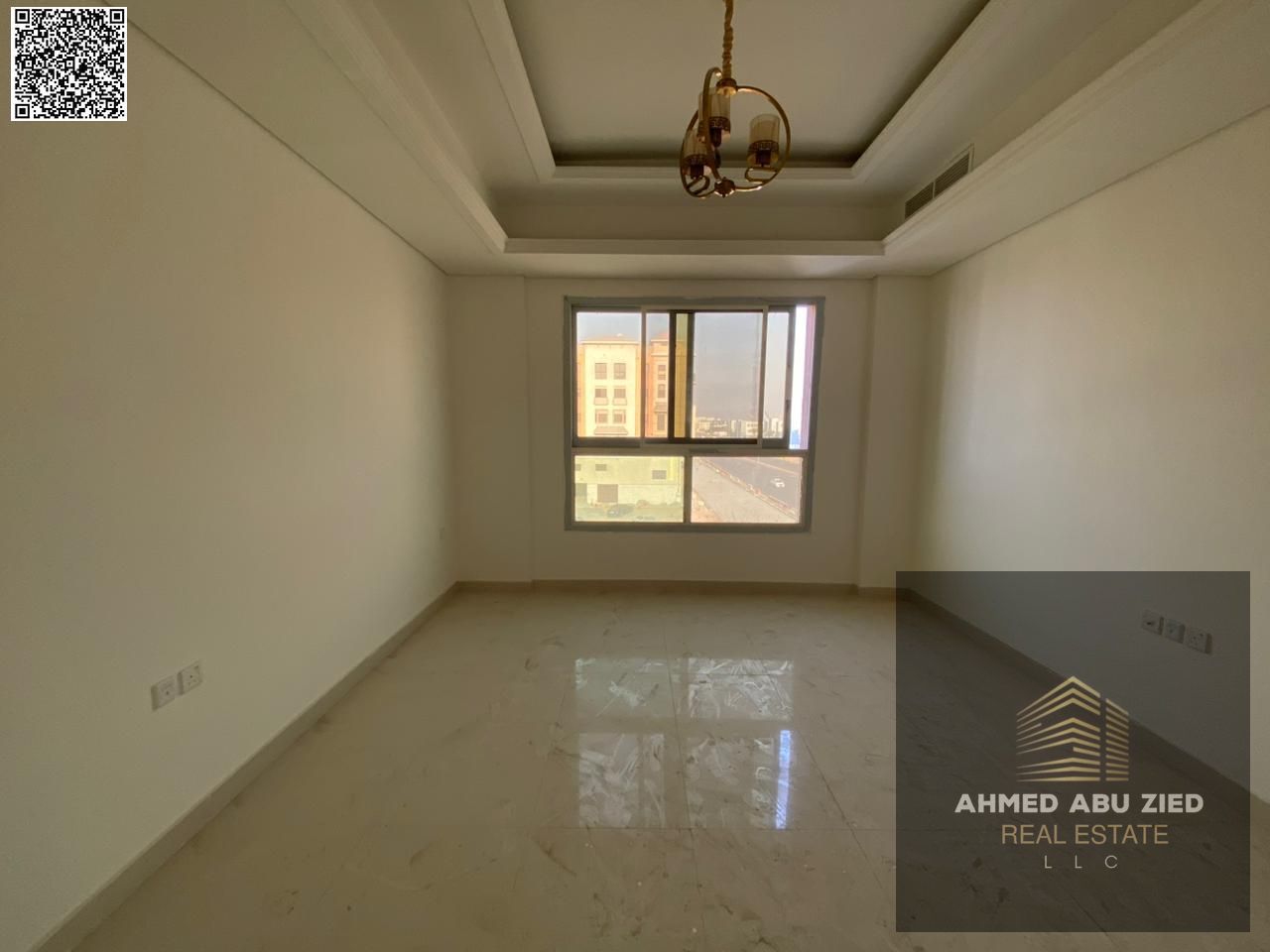 3BR hall first tenant, 1 month free, annual rent in Muwaihat. 3 baths, central AC, balcony, built-in wardrobes, high finish, spacious.