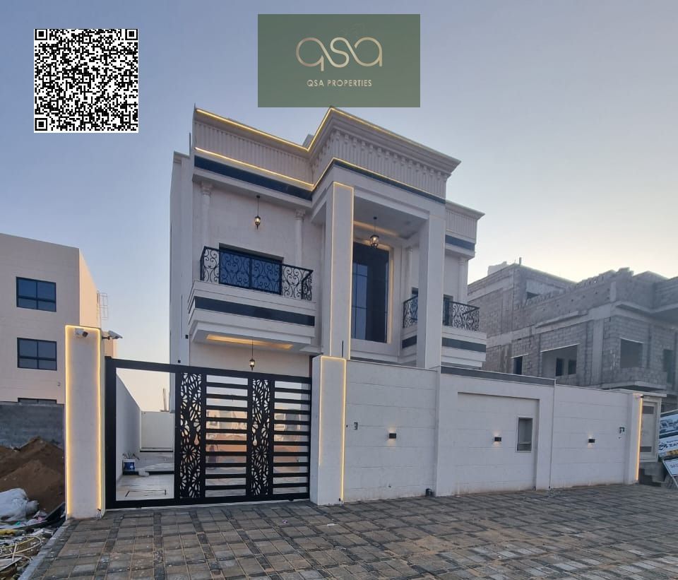 Luxury villa for sale in one of Ajman's best areas, including water, electricity, and air conditioning - featuring a luxurious modern design -