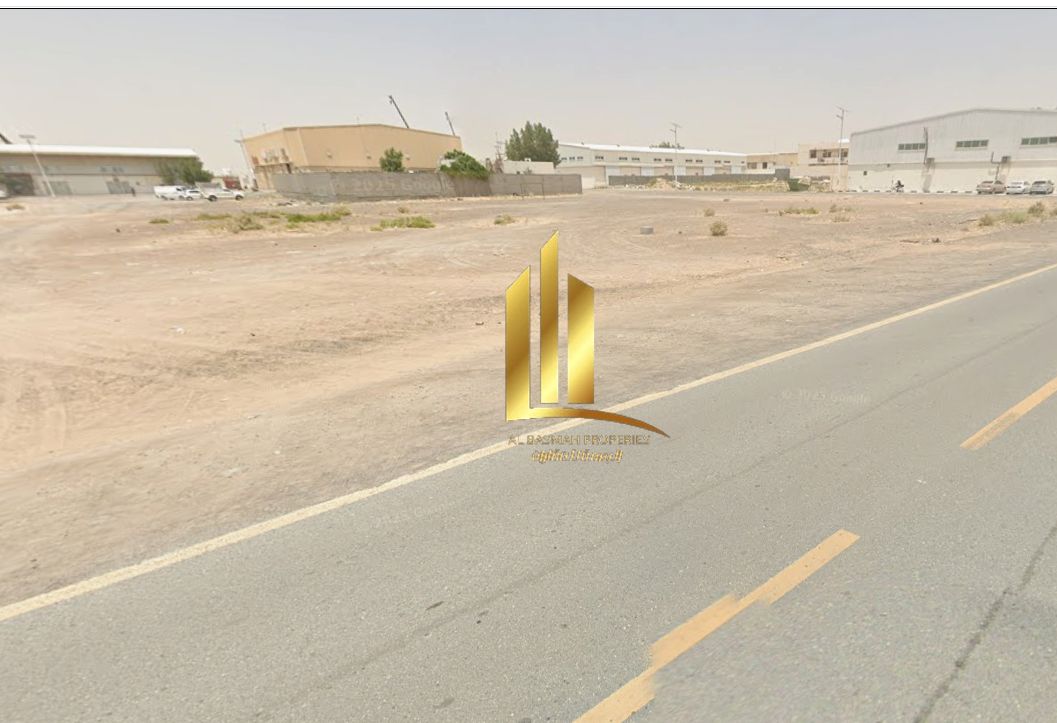 For sale in Sharjah, Al Sajaa Industrial Area, Sheikh Faisal, a plot of land measuring 27,000 square feet, prime location on an asphalt road.