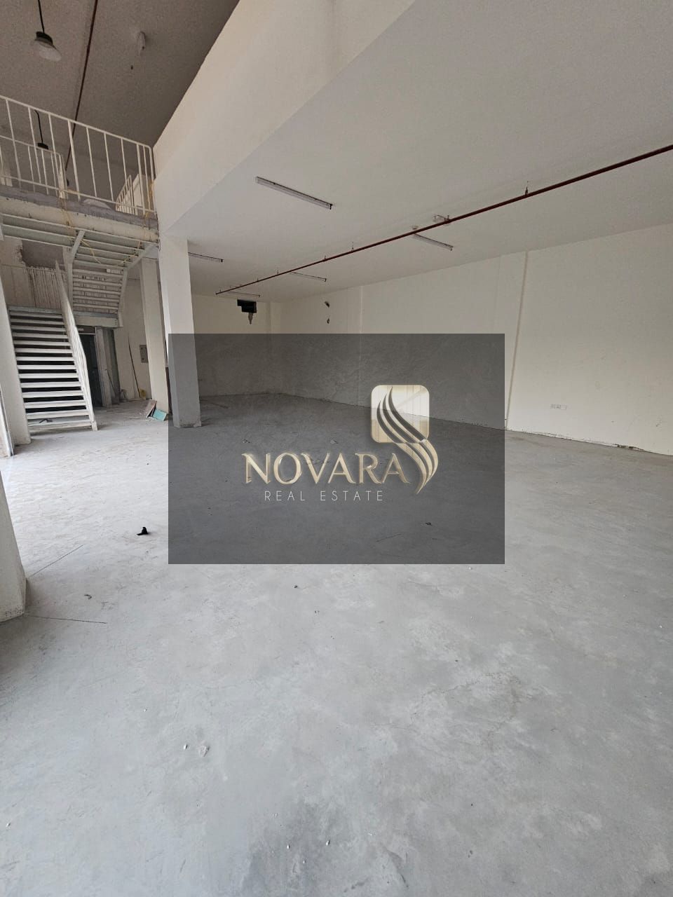 Warehouse for rent in Al Bahia, Ajman, 3,250 sq ft with mezzanine, 32 kW electricity, rent AED 155,000