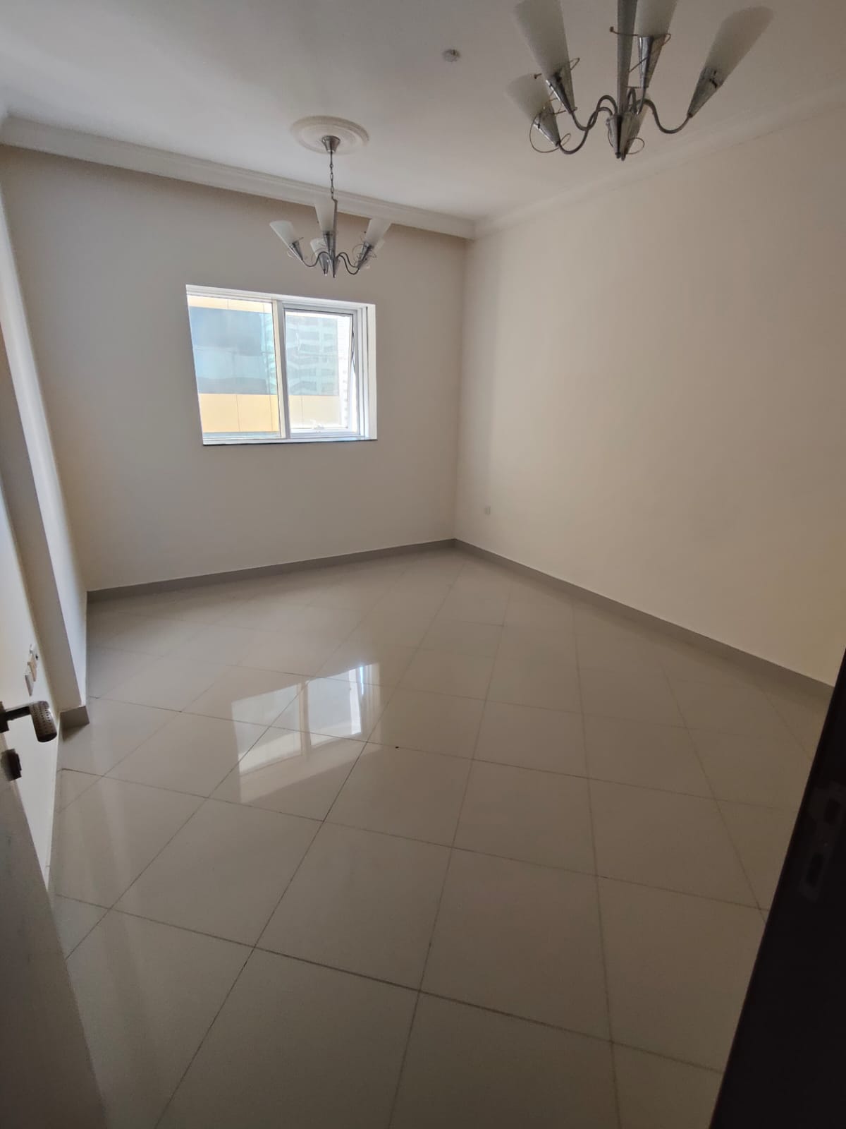 1BR apartment in Al Taawun near the Corniche, free parking, prime location close to services & transport, comfortable living.