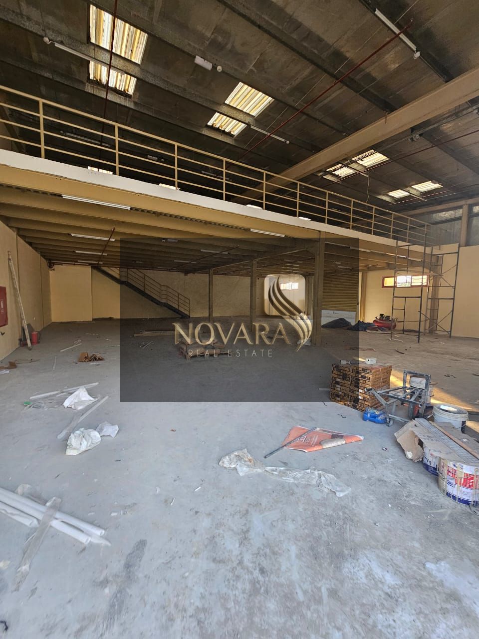 A new warehouse for rent in Al Jurf Industrial Area 1, Ajman, 6,000 sq ft with a mezzanine, 25 kW electricity, rent AED 310,000