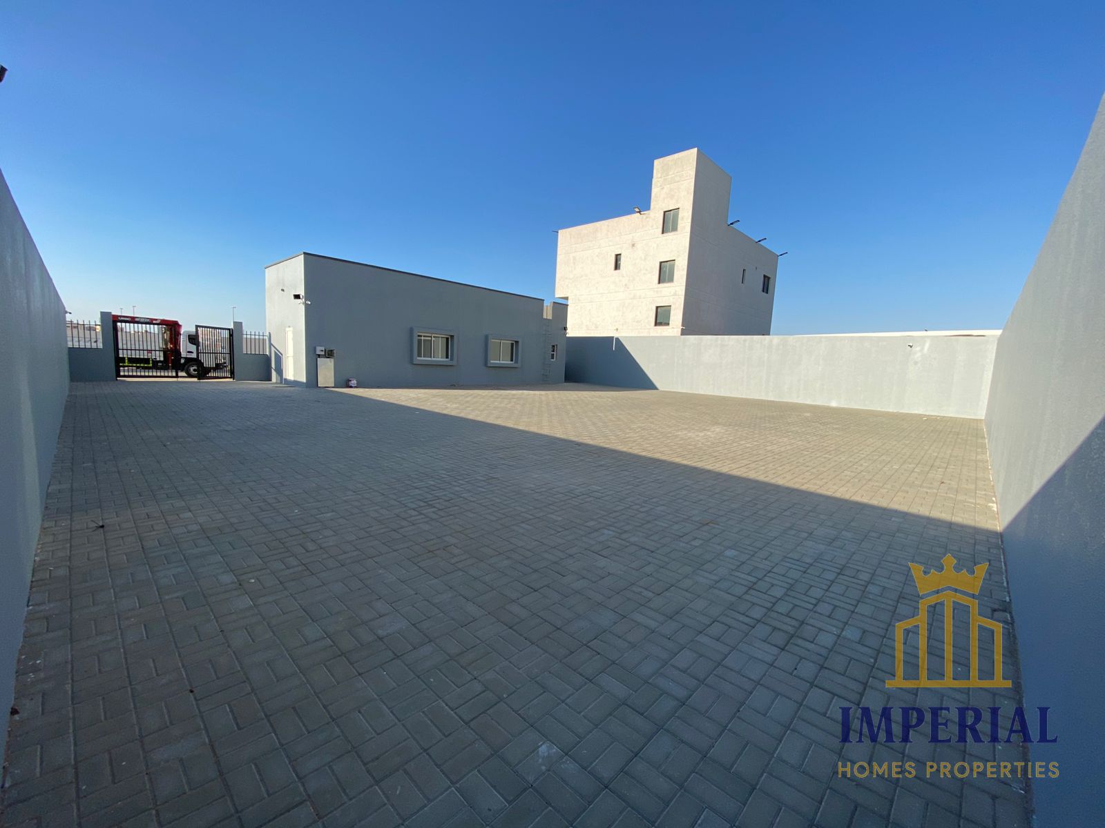 Industrial land enclosed by a fence (wall) on an area of 6700 sq ft with 80 kW of electricity
