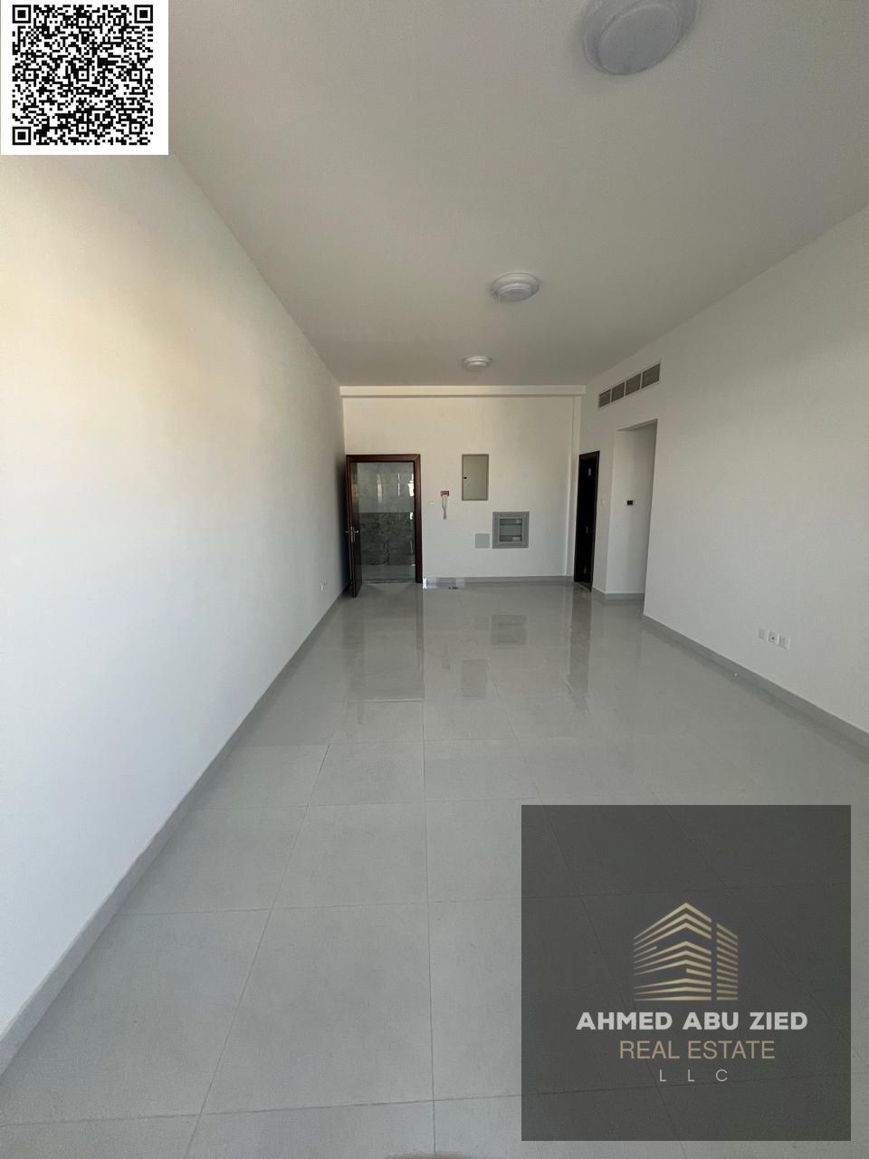 Luxury apartment for annual rent in Al Jurf 2, Ajman, featuring 2 master bedrooms, spacious hall, balcony with a nice view, high-end finishing, and pr