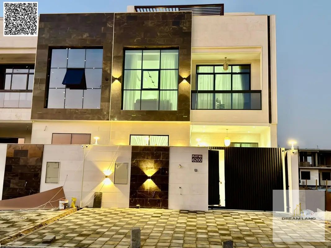 Direct from the owner, including all ownership fees: a villa in one of Ajman's most luxurious villas, built and finished to a super deluxe standard, w