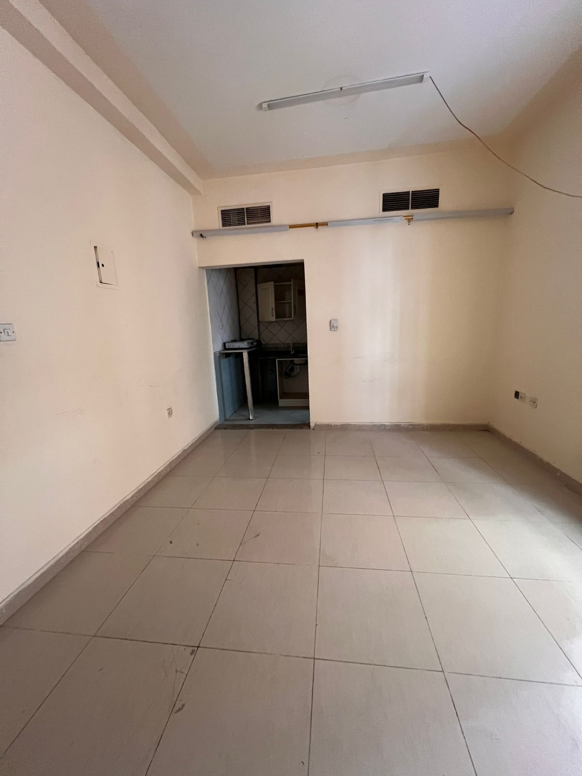 Studio in Al Boutina, family only, rent 18,000 AED, 6 installments, central AC & gas, spacious.
