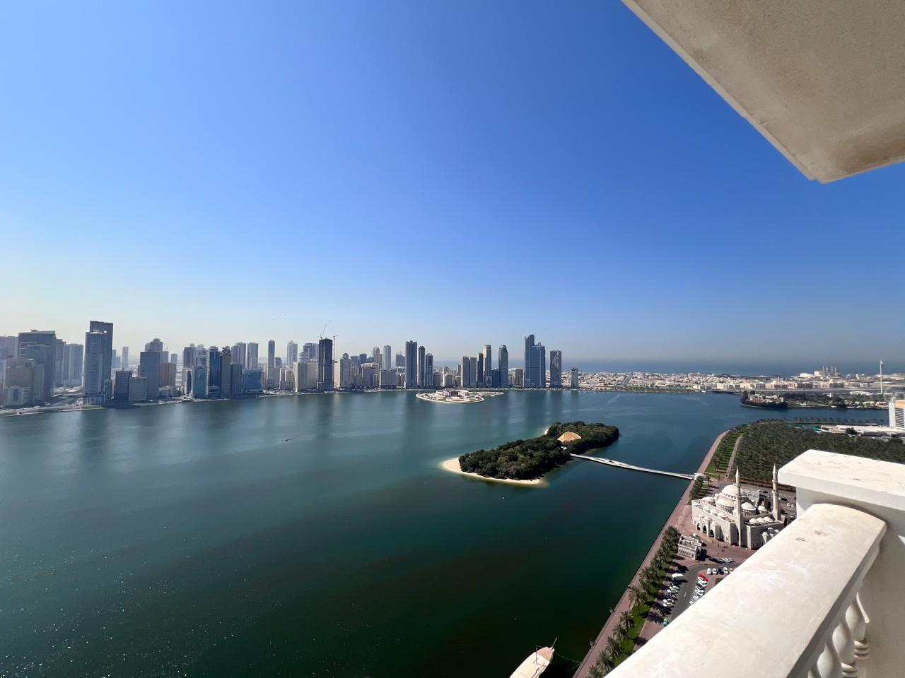 Free central AC, parking, gym, and swimming pool. Balcony with an open view overlooking the Al Majaz Corniche. Central air conditioning and central