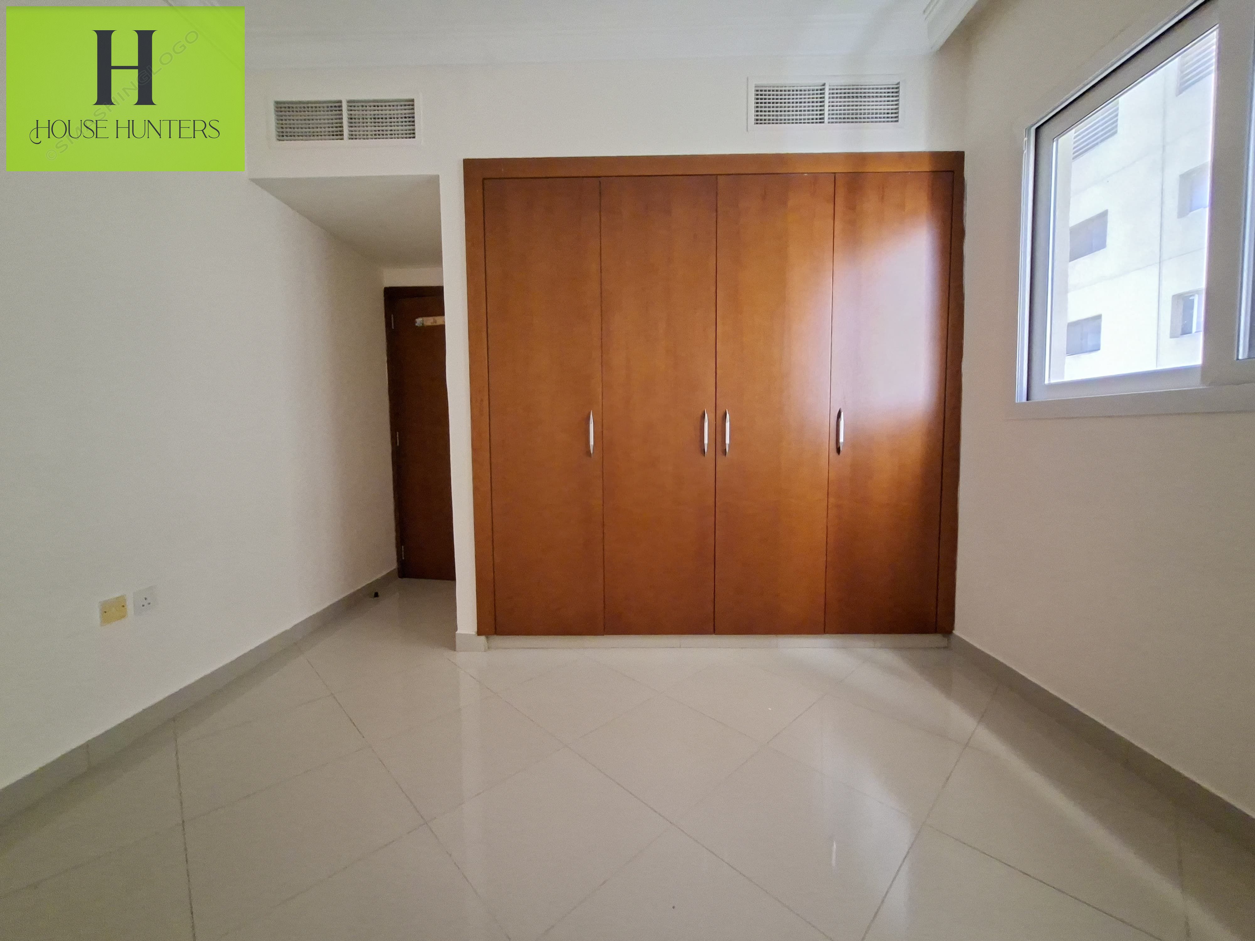 LAVISH 1BHK WITH BALCONY +GYM -SWIMMING POOL FREE -KIDS PLAYING AERA FREE EASY EXIT TO DUBAI