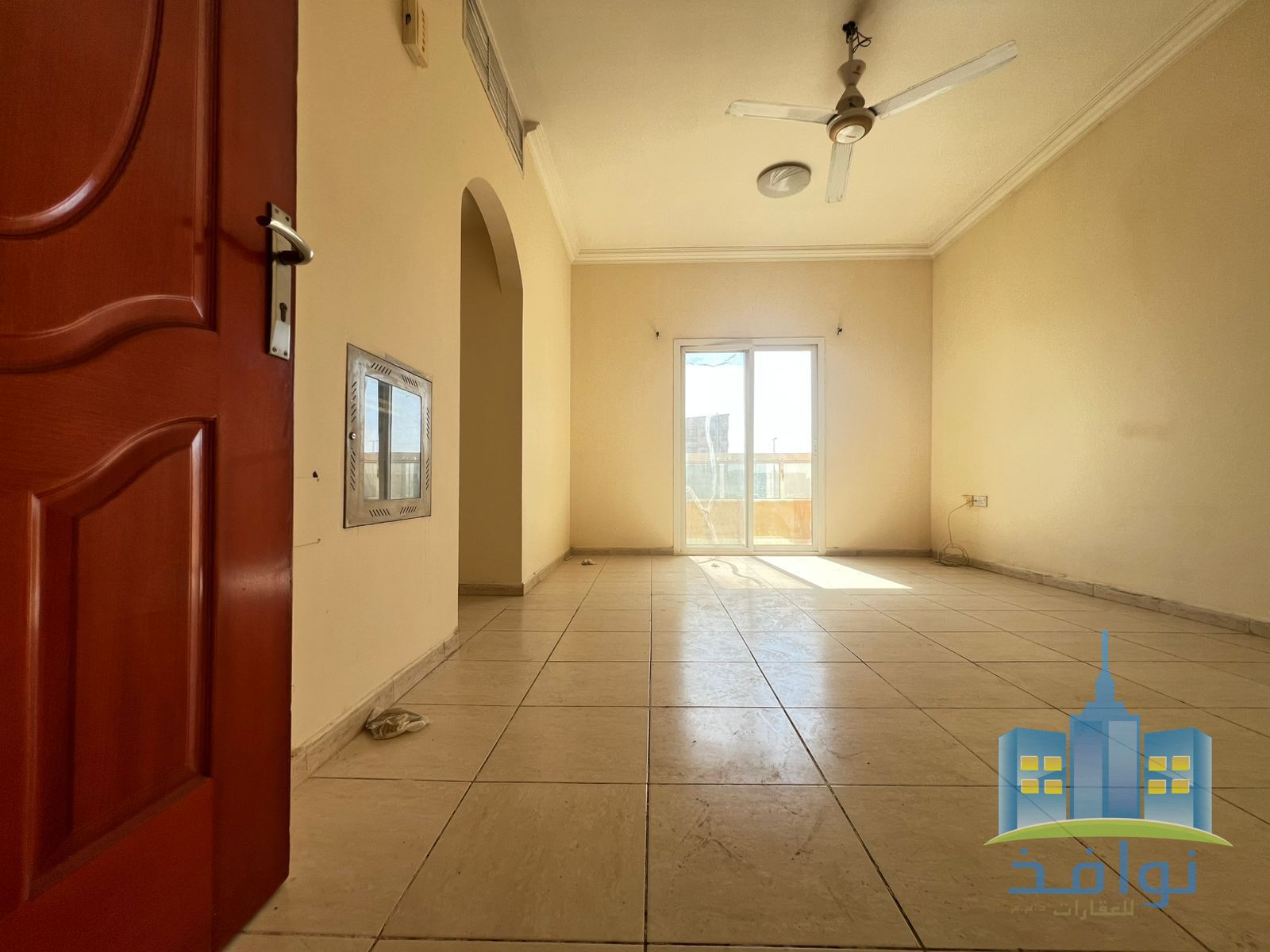 A room and a living room for rent with a spacious area and a balcony.