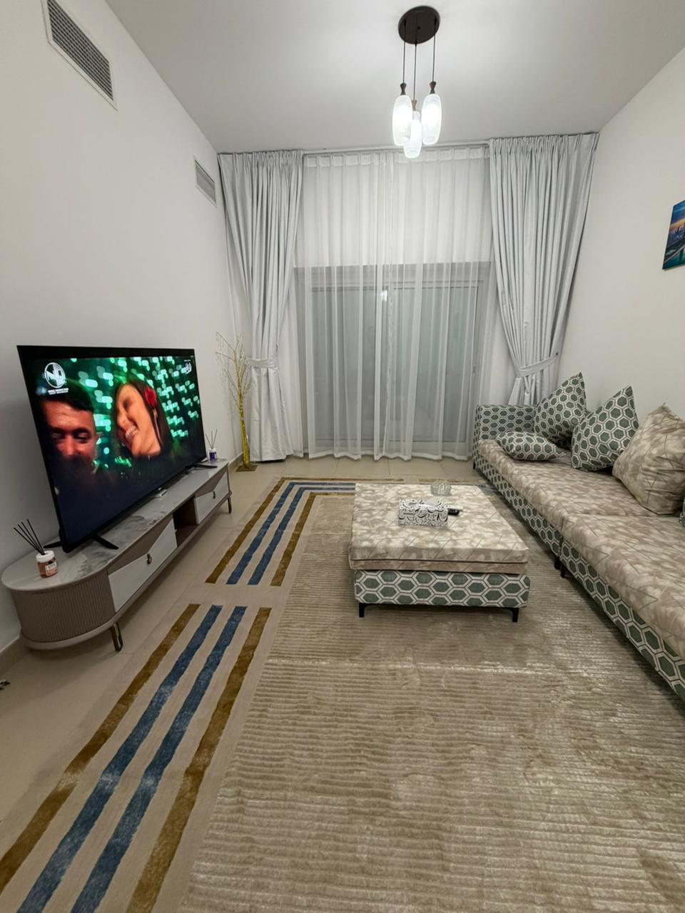 For rent in Ajman, first tenant, Al Nuaimia, next to Han Cafe. Two bedrooms and a living room with a large space, 2 balconies, 3 bathrooms + parking c