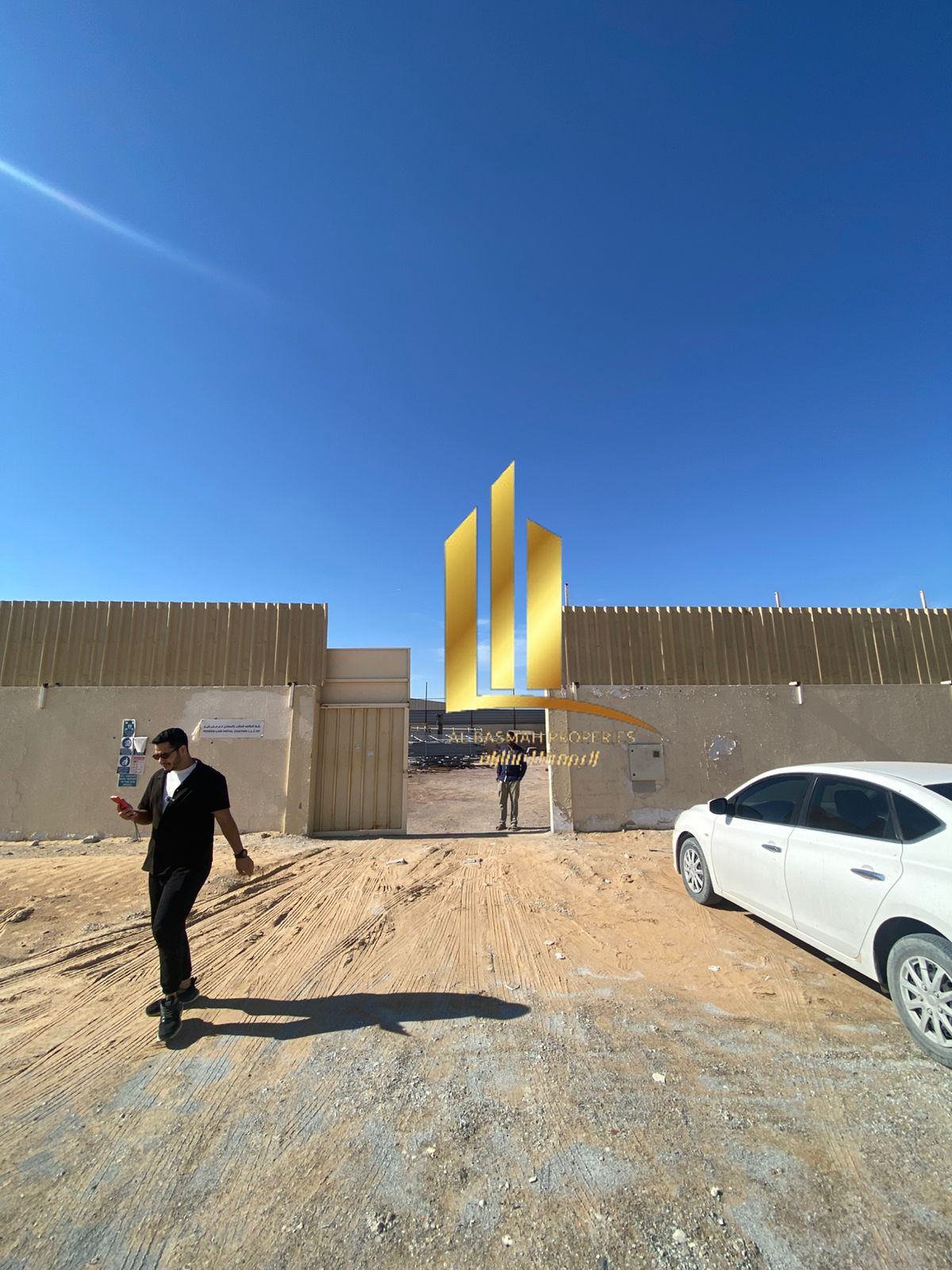 For sale in Al Sajaa Industrial, a fenced building with a canopy for the exclusive price of 1,900,000.