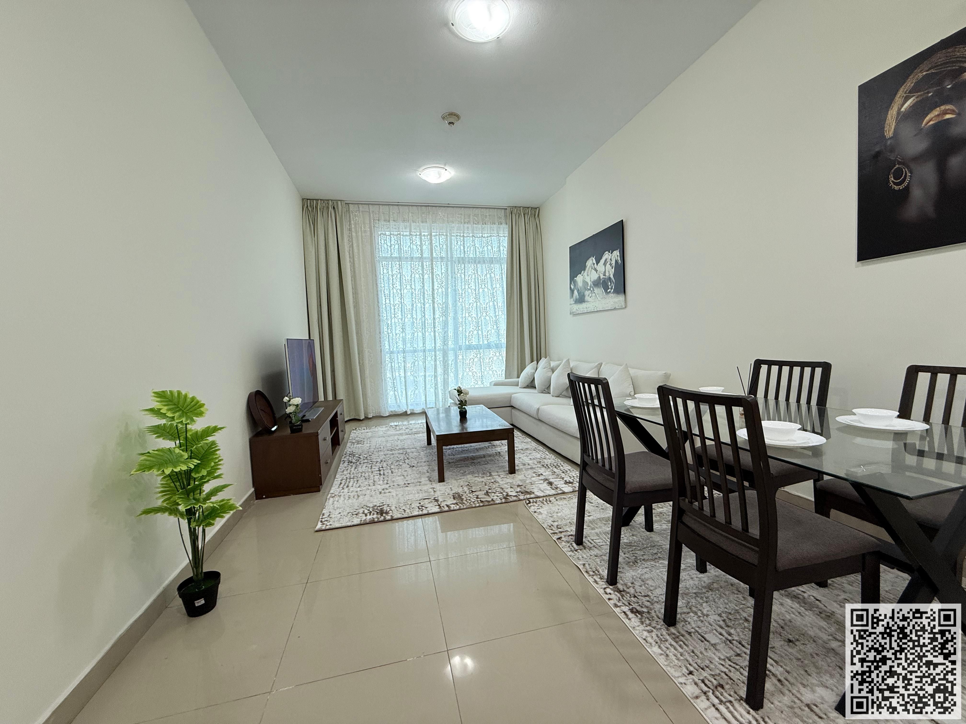 Luxurious and elegant one-bedroom apartment, fully furnished with brand new, high-end furniture, and includes a private parking space.