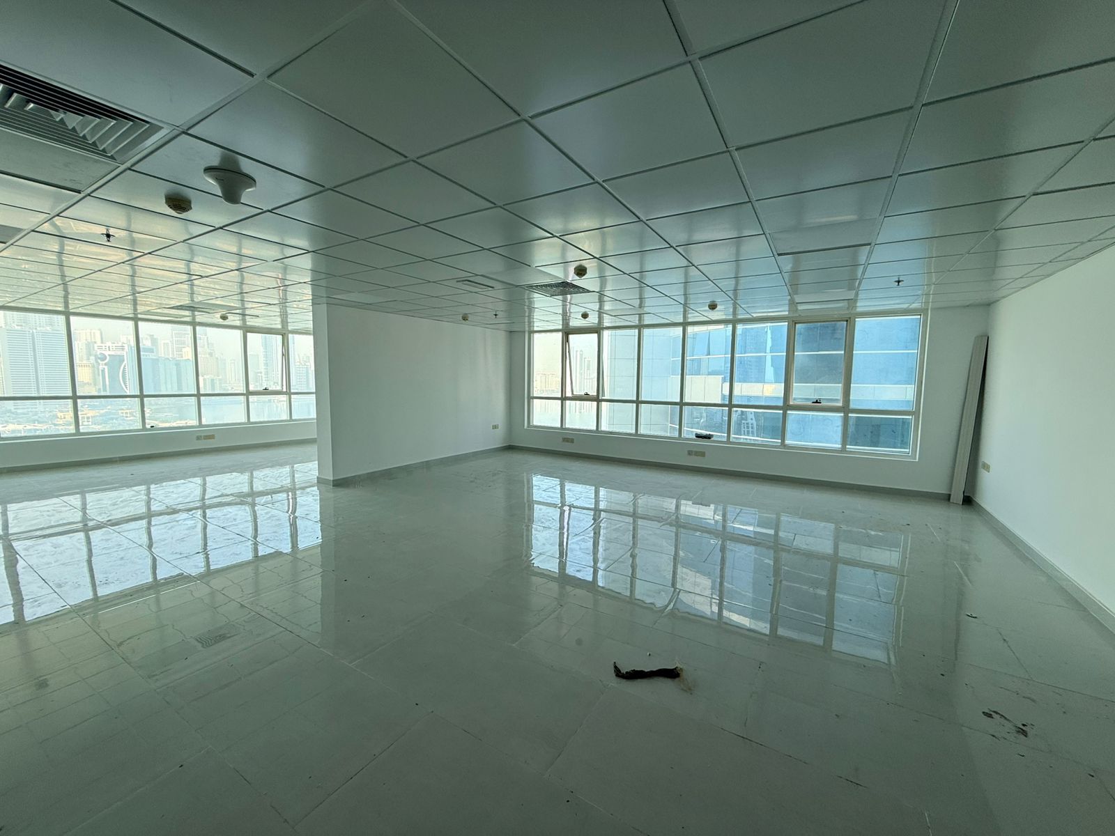 Spacious commercial office for rent in Al Majaz 2, suitable for all commercial activities - with parking inside the tower - in one of the most famous