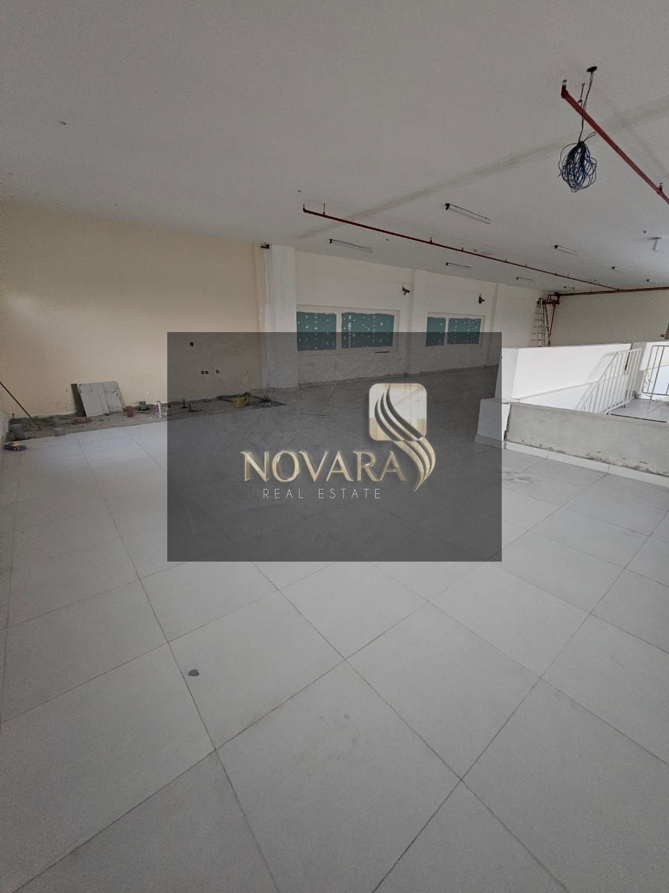 Warehouse in Al Bahia, Ajman, 3250 sq ft, mezzanine, 32 kW electricity, prime location suitable for storage and activities, rent AED 165,000 per year.
