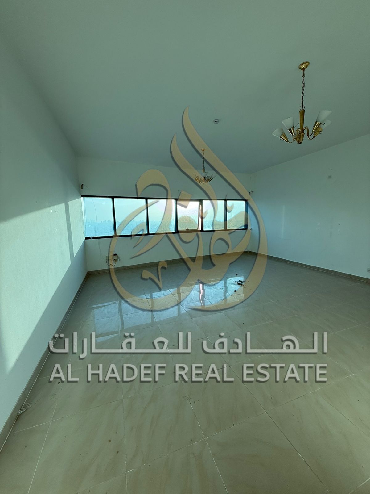 Two-bedroom apartment with a living room and maid's room in Al Taawun, directly on the Dubai exit - Gym and swimming pool for men and women - Tennis c