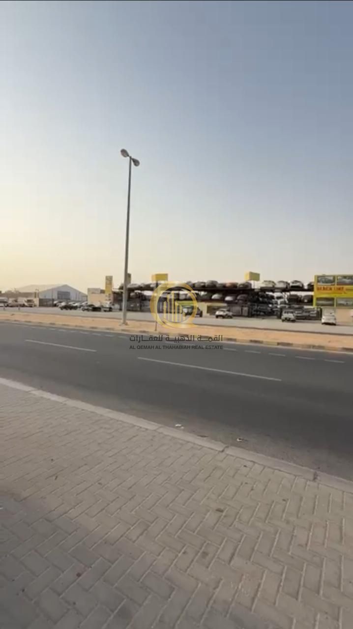 Opportunity No. (53) for sale: a plot of land in the Al Sajaa Industrial Area, opposite the scrap yard, with an area of 21,500 square feet.