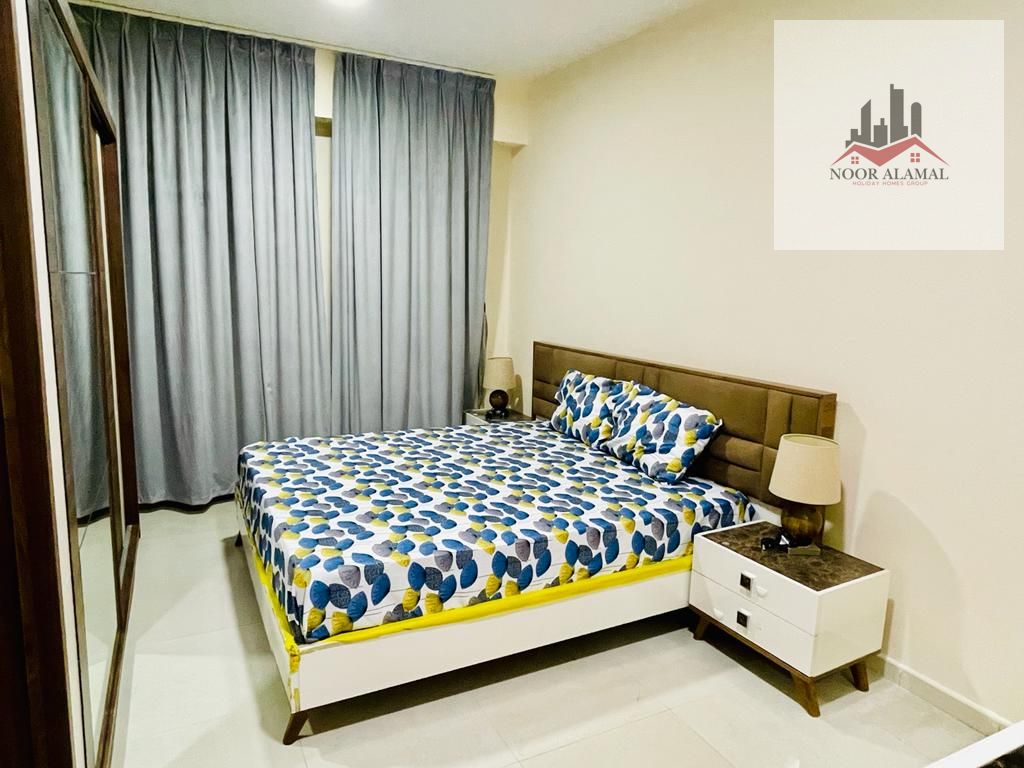 Sharjah, Al Majaz 3 One bedroom, living room, kitchen, two bathrooms, and balcony.