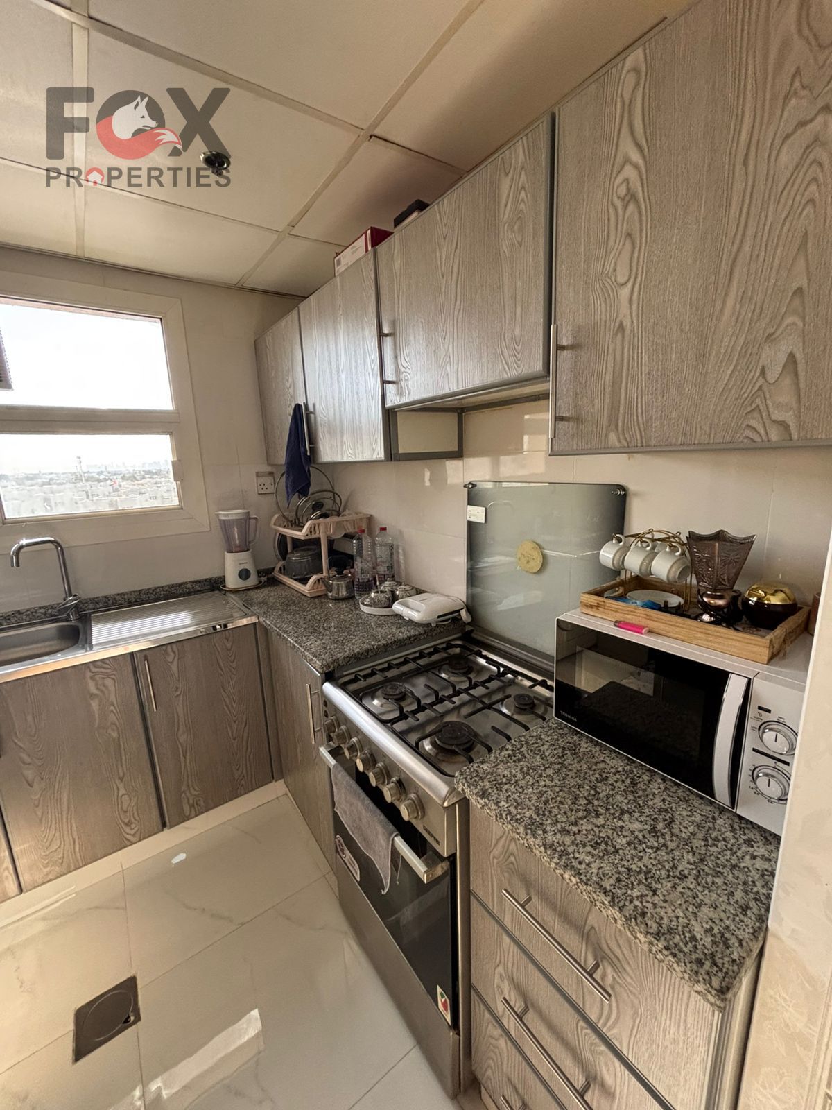 Furnished studio apartment for rent in Al Nuaimiya 2, Ajman, behind Al Nuaimiya Police Station, near Safeer Mall and College Street. Separate kitchen,