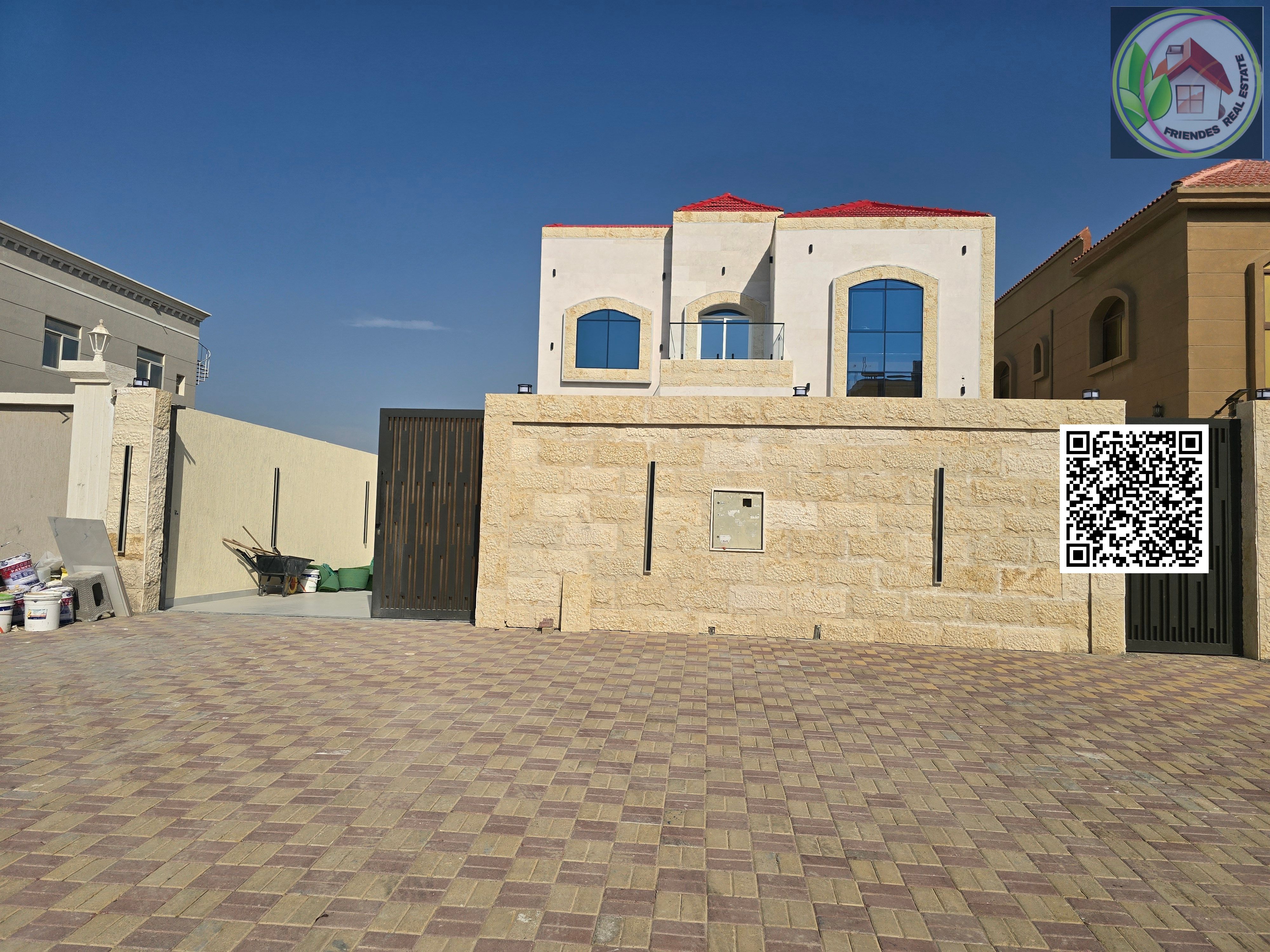 A luxurious villa with a modern design, located in Al Muwaihat 1, featuring spacious areas and high-quality finishes, with an ideal location directly opposite the mosque.