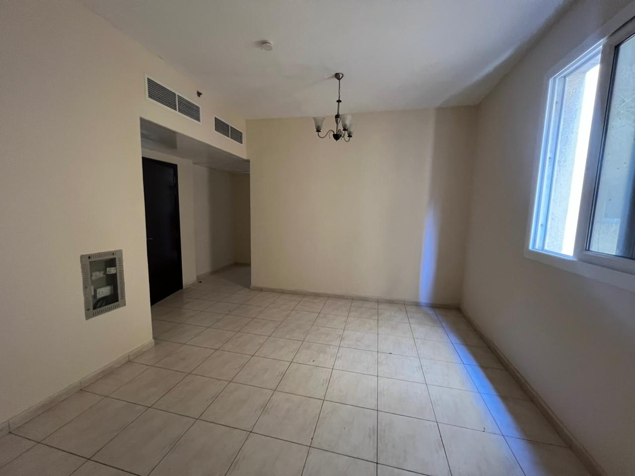 Luxury finishes apartment in Al Majarah, 1,600 sq. ft. , wide layout, open view, central AC, free maintenance, prime location.