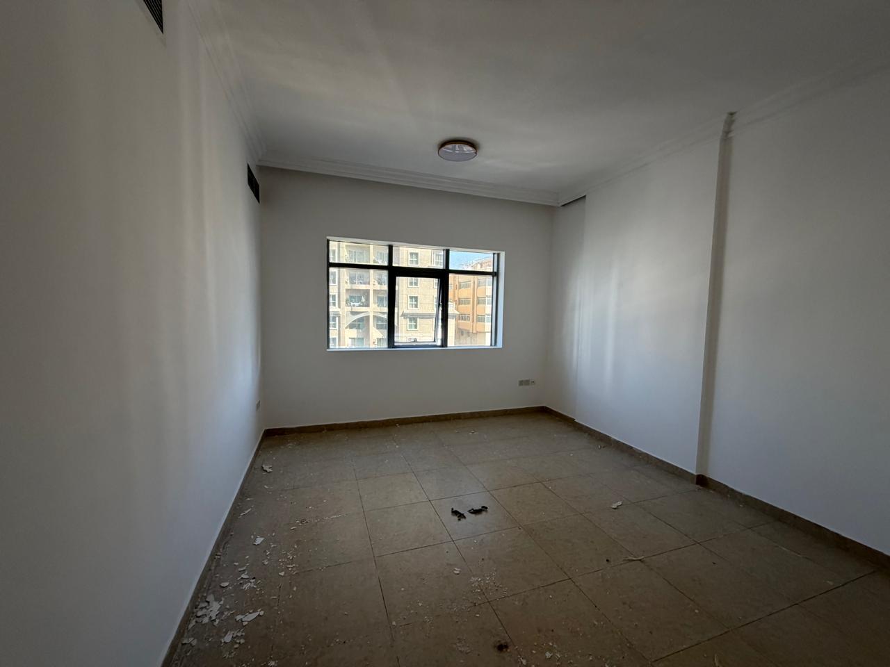 Furnished 2BR apartment in Al Khan with sea view, 2 balconies, parking, gym, pool, and flexible payment options.